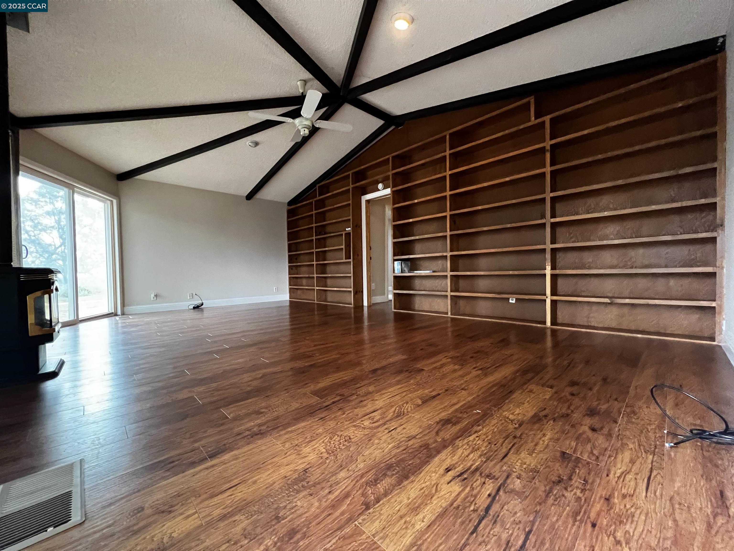 14630 St Croy Road Red Bluff, CA 96080 - Photo 15 of 29 a view of an empty room with wooden floor and a window