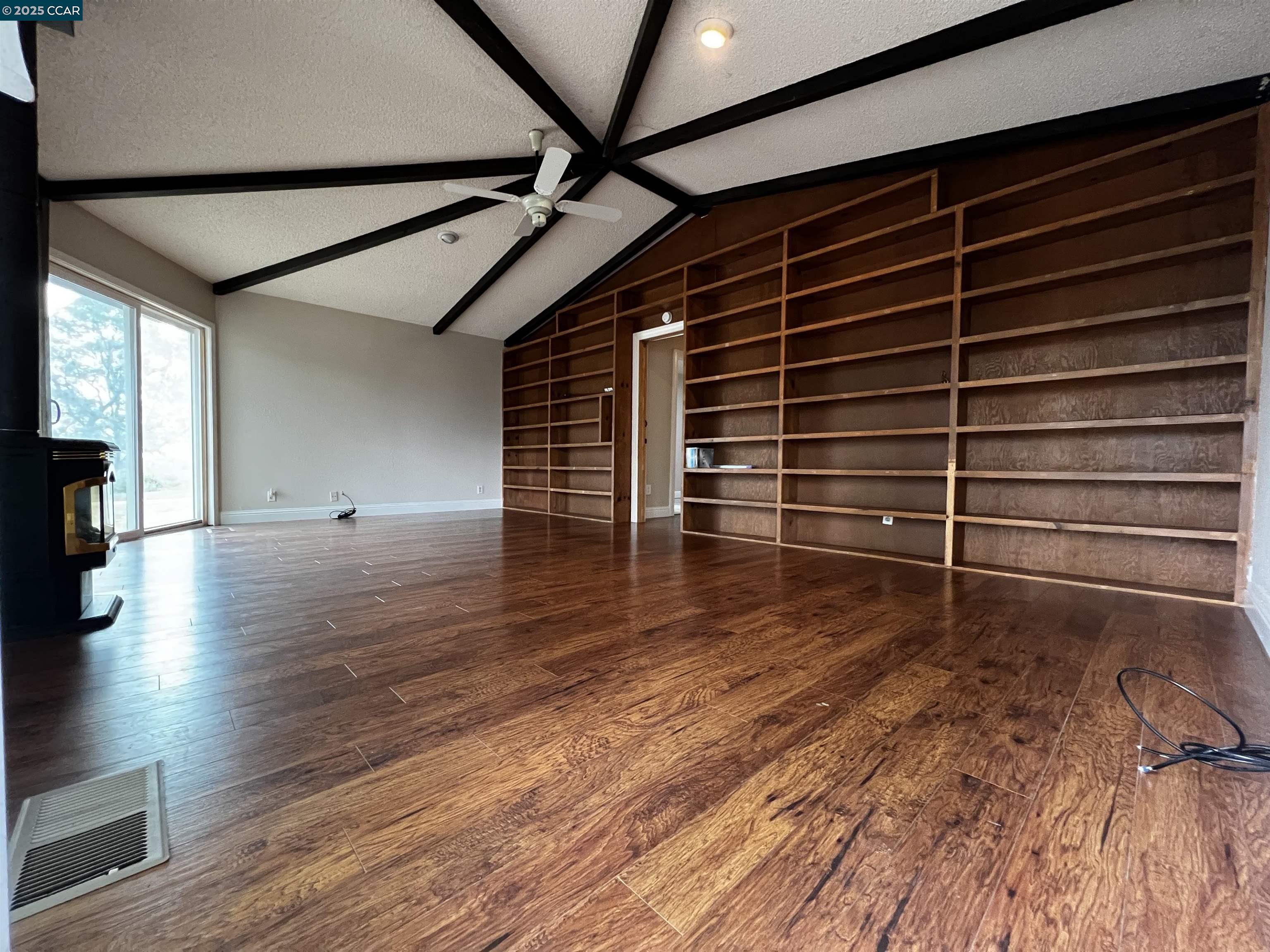 14630 St Croy Road Red Bluff, CA 96080 - Photo 16 of 29 a view of an empty room with wooden floor and a window