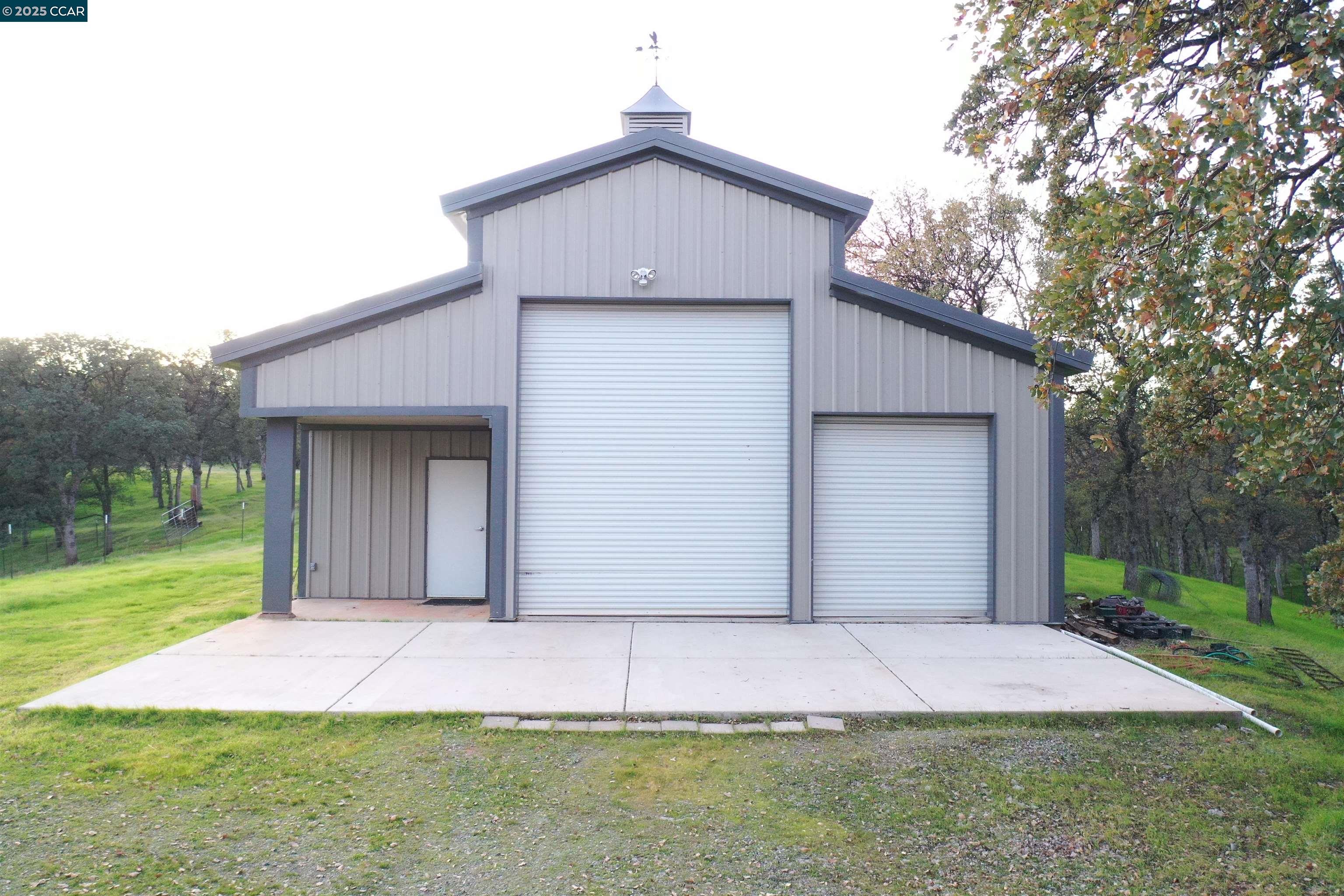 14630 St Croy Road Red Bluff, CA 96080 - Photo 20 of 29 a front view of a house with a yard and garage