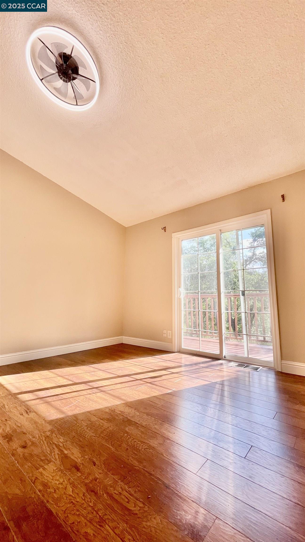 14630 St Croy Road Red Bluff, CA 96080 - Photo 6 of 29 a view of an empty room with wooden floor and a window