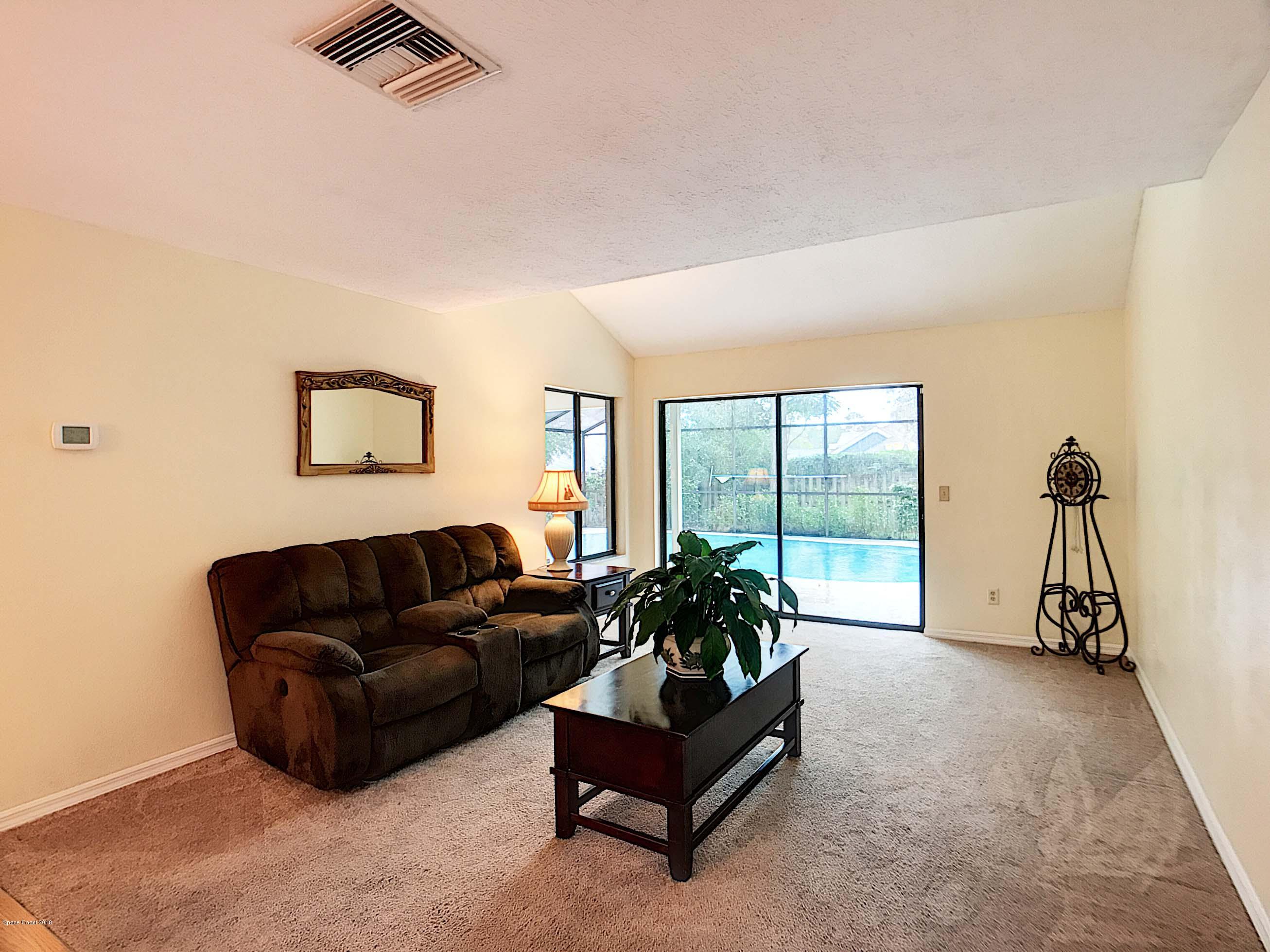 359 Lake Road Lake Mary, FL 32746 - Photo 21 of 34 Living room to Pool