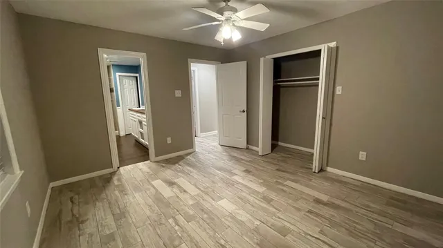 a hallway with furniture and wooden floor