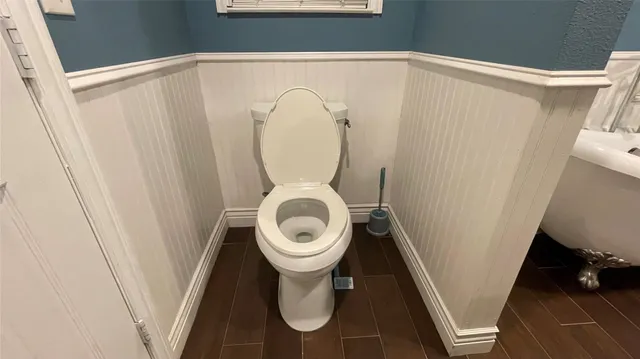 a white bath tub sitting next to a white sink