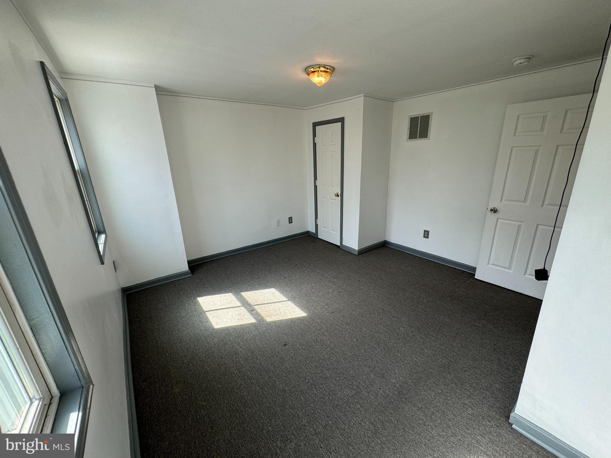 413 South Braddock Street Winchester, VA 22601 - Photo 11 of 20 an empty room with a door