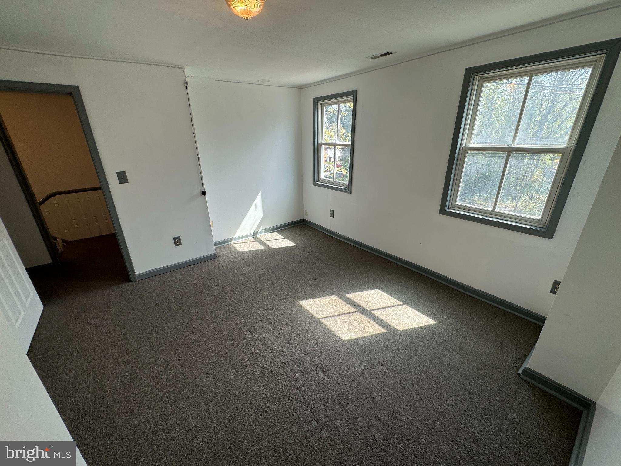 413 South Braddock Street Winchester, VA 22601 - Photo 12 of 20 a view of an empty room with a window