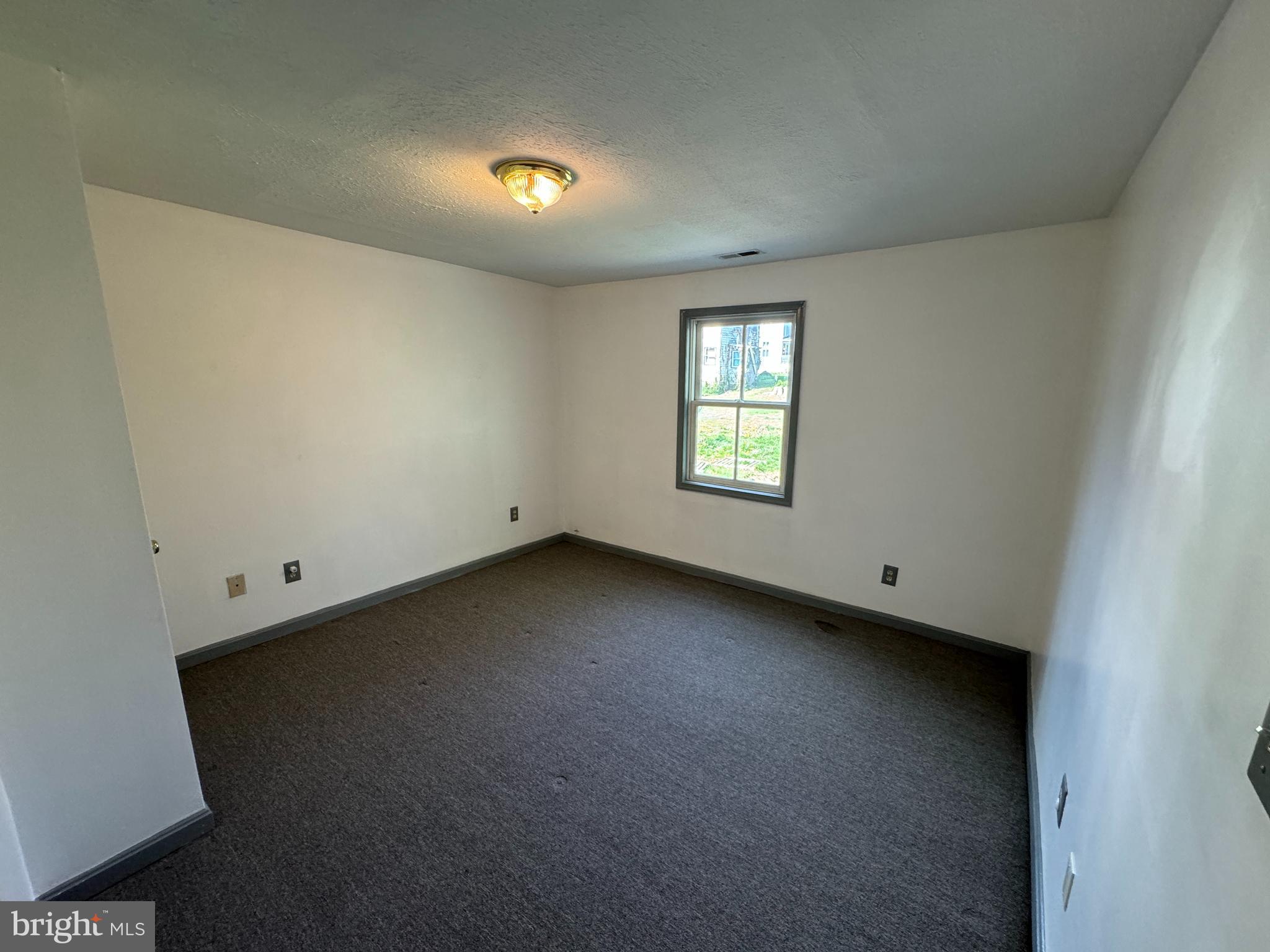 413 South Braddock Street Winchester, VA 22601 - Photo 13 of 20 a view of a room that has a window