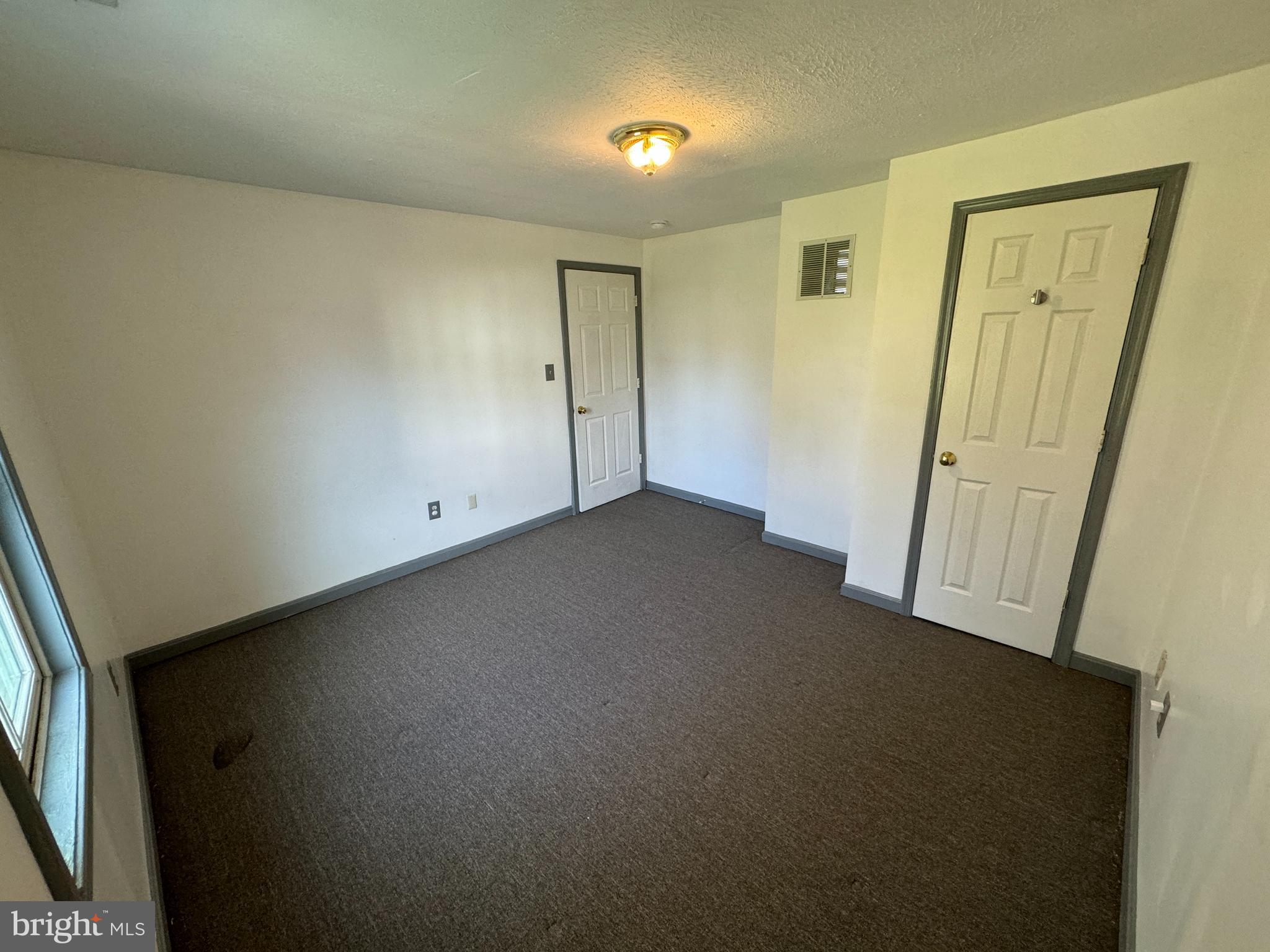 413 South Braddock Street Winchester, VA 22601 - Photo 14 of 20 an empty room with windows
