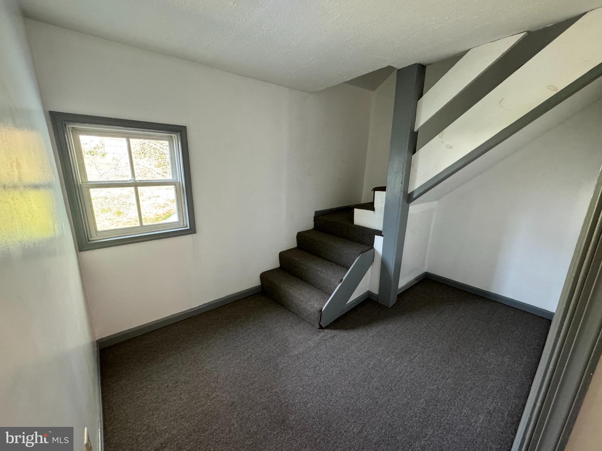 413 South Braddock Street Winchester, VA 22601 - Photo 15 of 20 a view of an empty room with stairs