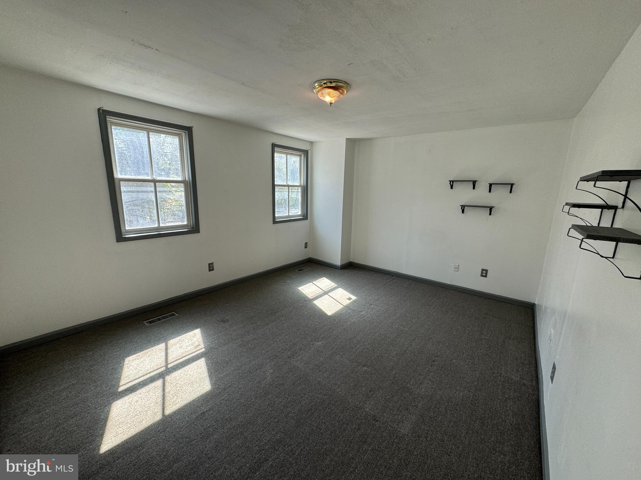 413 South Braddock Street Winchester, VA 22601 - Photo 2 of 20 a view of an empty room with a window