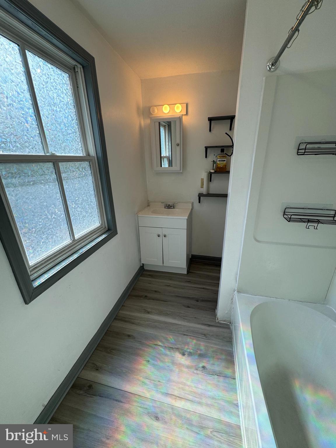 413 South Braddock Street Winchester, VA 22601 - Photo 10 of 20 a bathroom with a sink toilet and tub