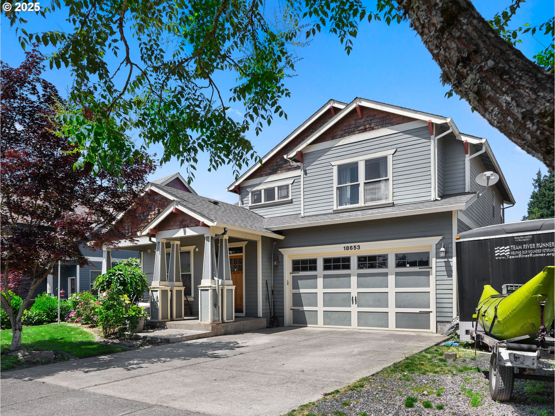 18653 Van Fleet Avenue Sandy, OR 97055 - Photo 1 of 48 a front view of a house with garden