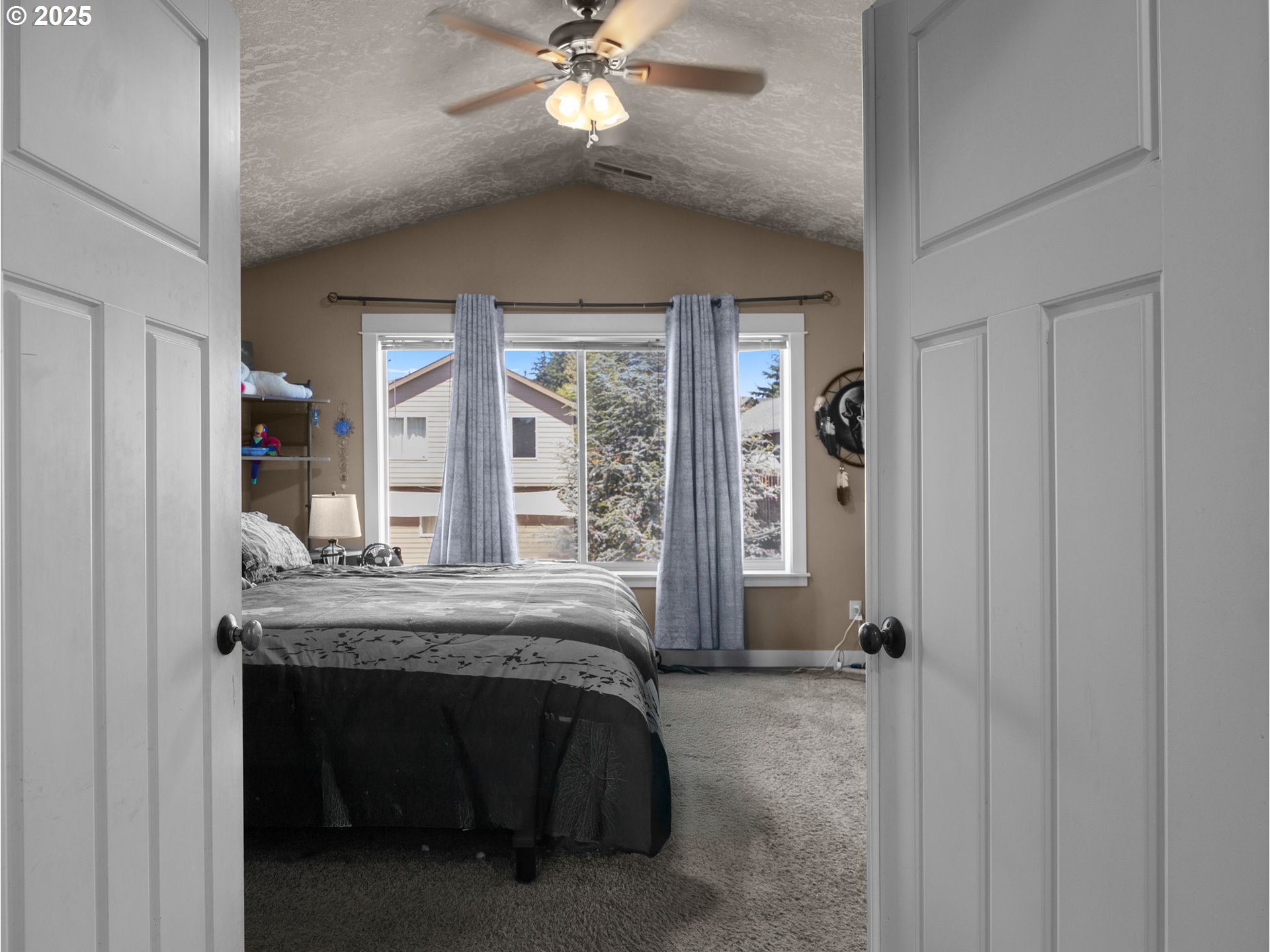 18653 Van Fleet Avenue Sandy, OR 97055 - Photo 30 of 48 a bedroom with a bed and large windows