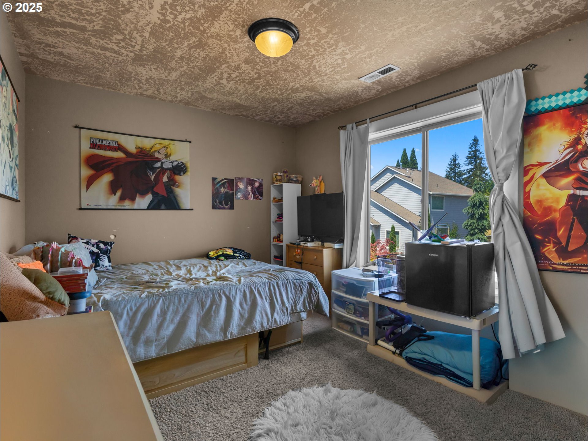 18653 Van Fleet Avenue Sandy, OR 97055 - Photo 41 of 48 a bedroom with furniture and a flat screen tv