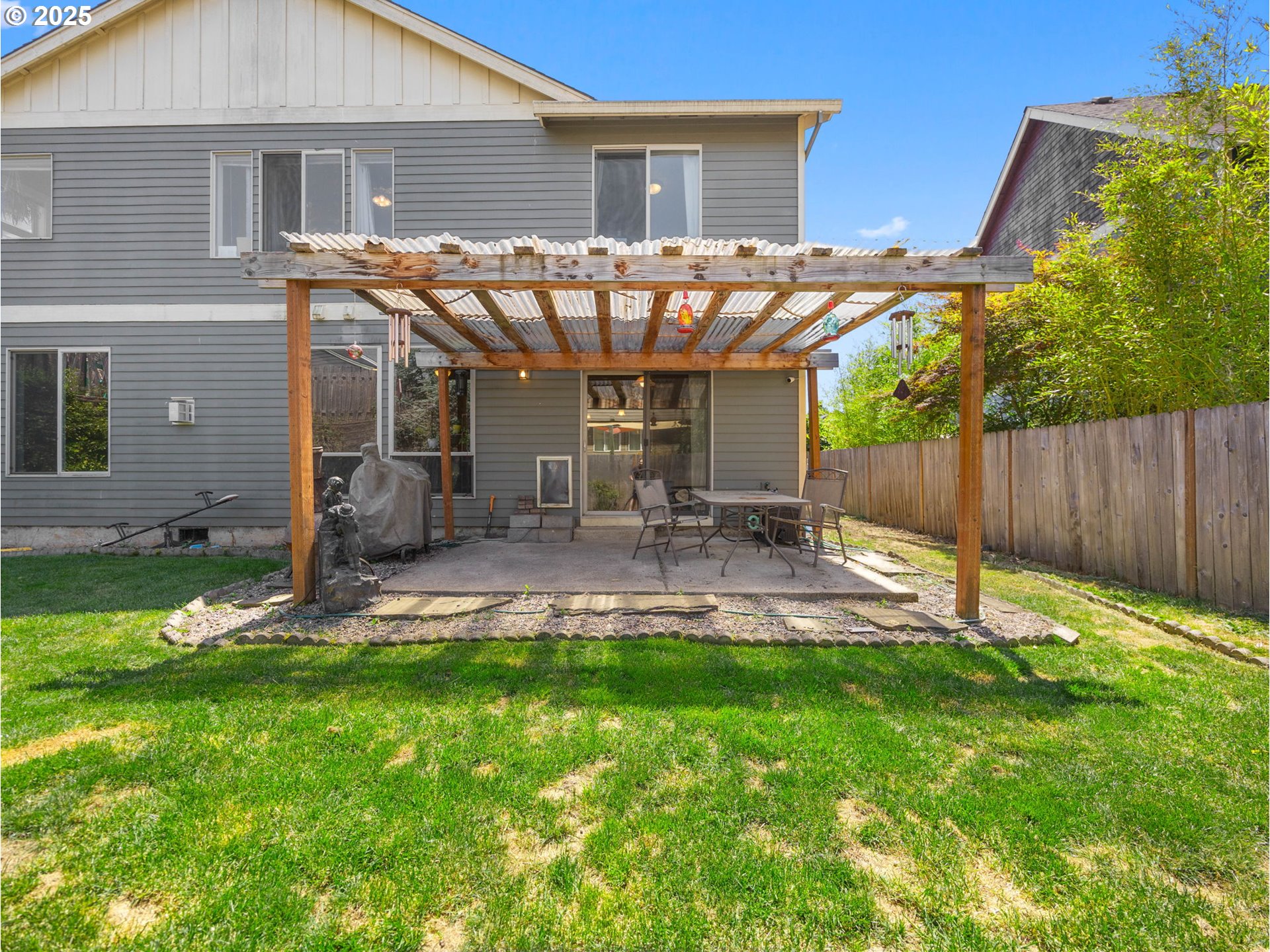 18653 Van Fleet Avenue Sandy, OR 97055 - Photo 48 of 48 a view of a house with a backyard and a patio