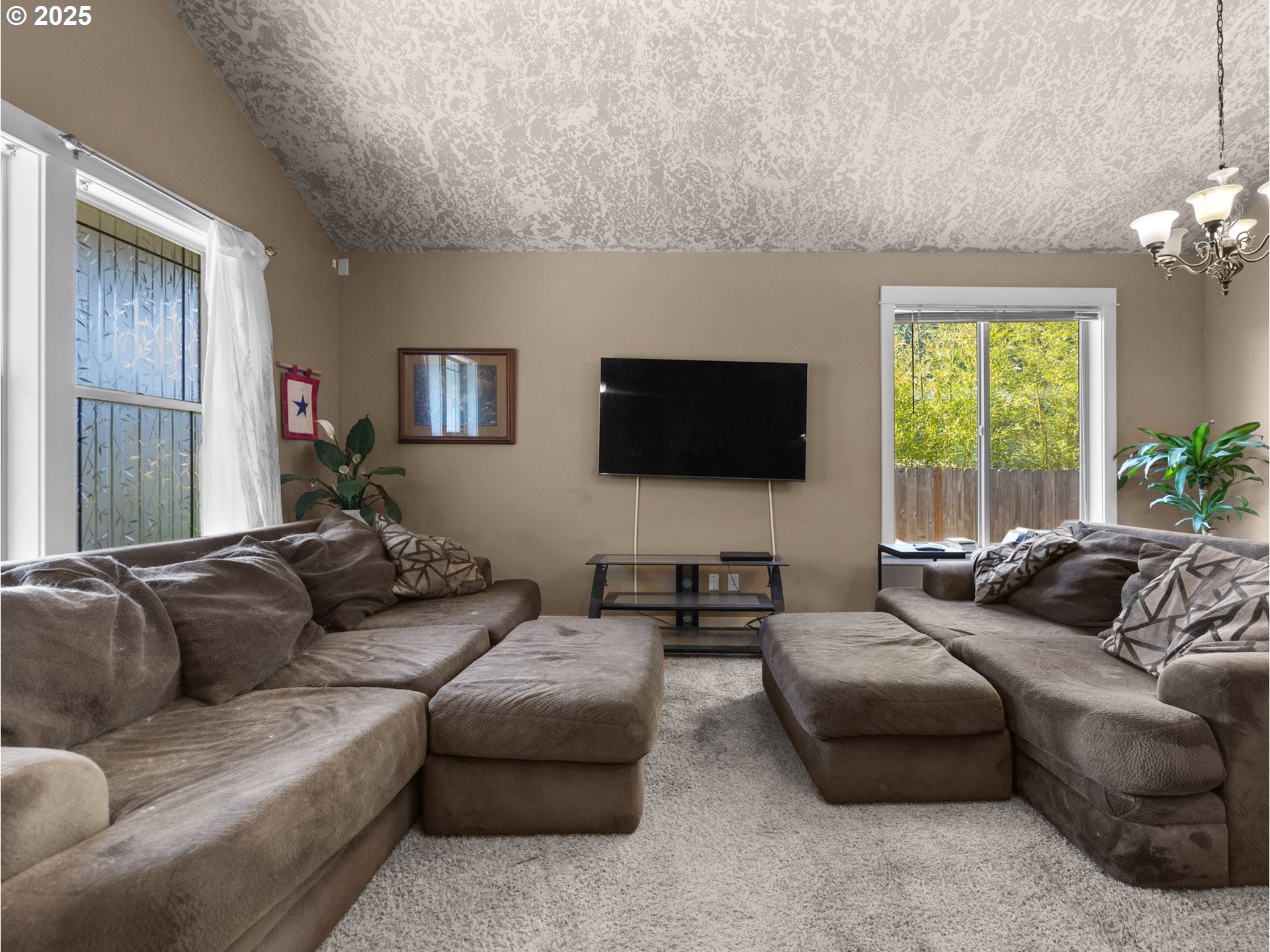 18653 Van Fleet Avenue Sandy, OR 97055 - Photo 6 of 48 a living room with furniture flat screen tv and a large window