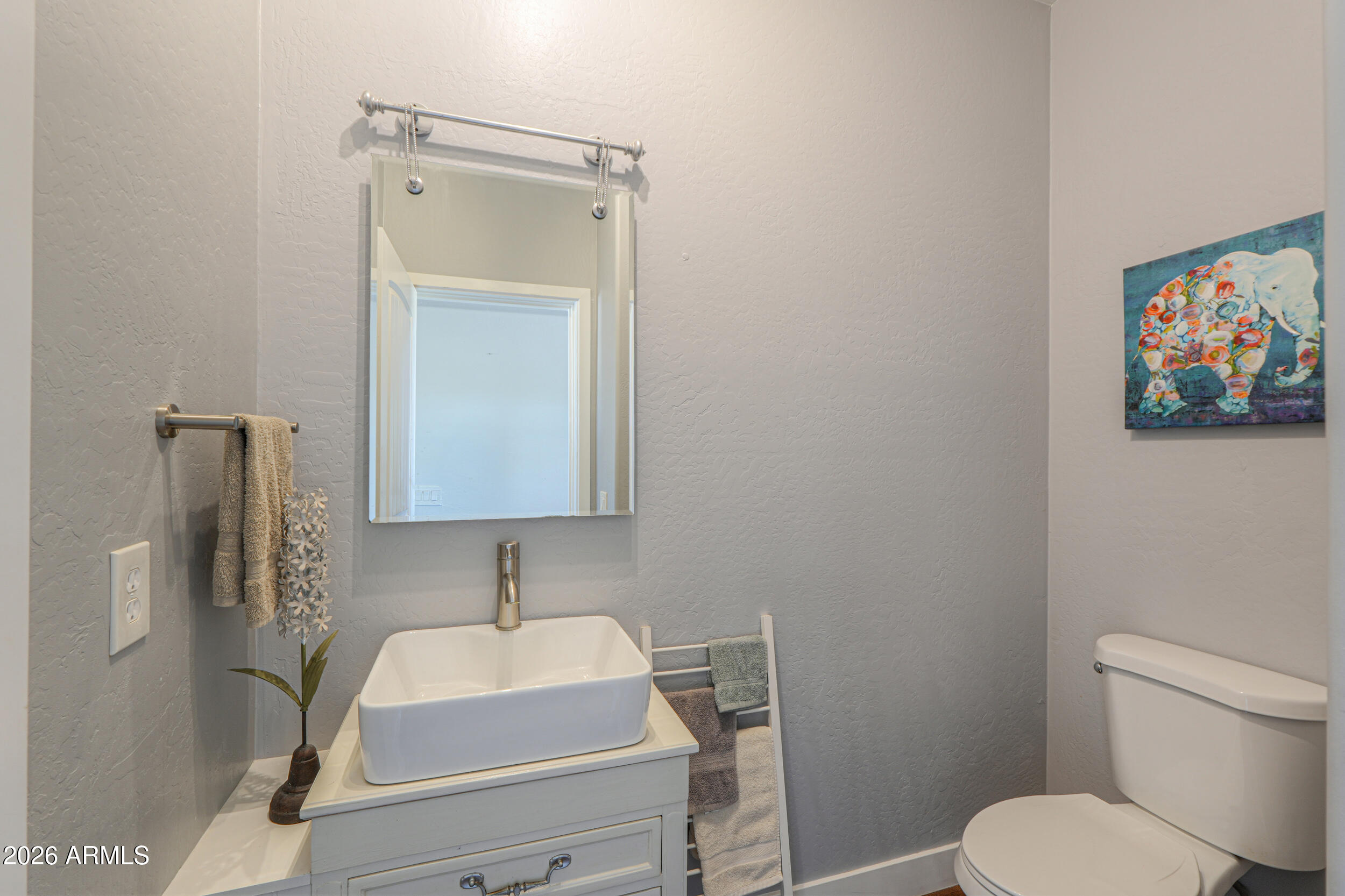 11422 North Hazeldine Road Casa Grande, AZ 85194 - Photo 20 of 59 a bathroom with a toilet sink vanity and mirror