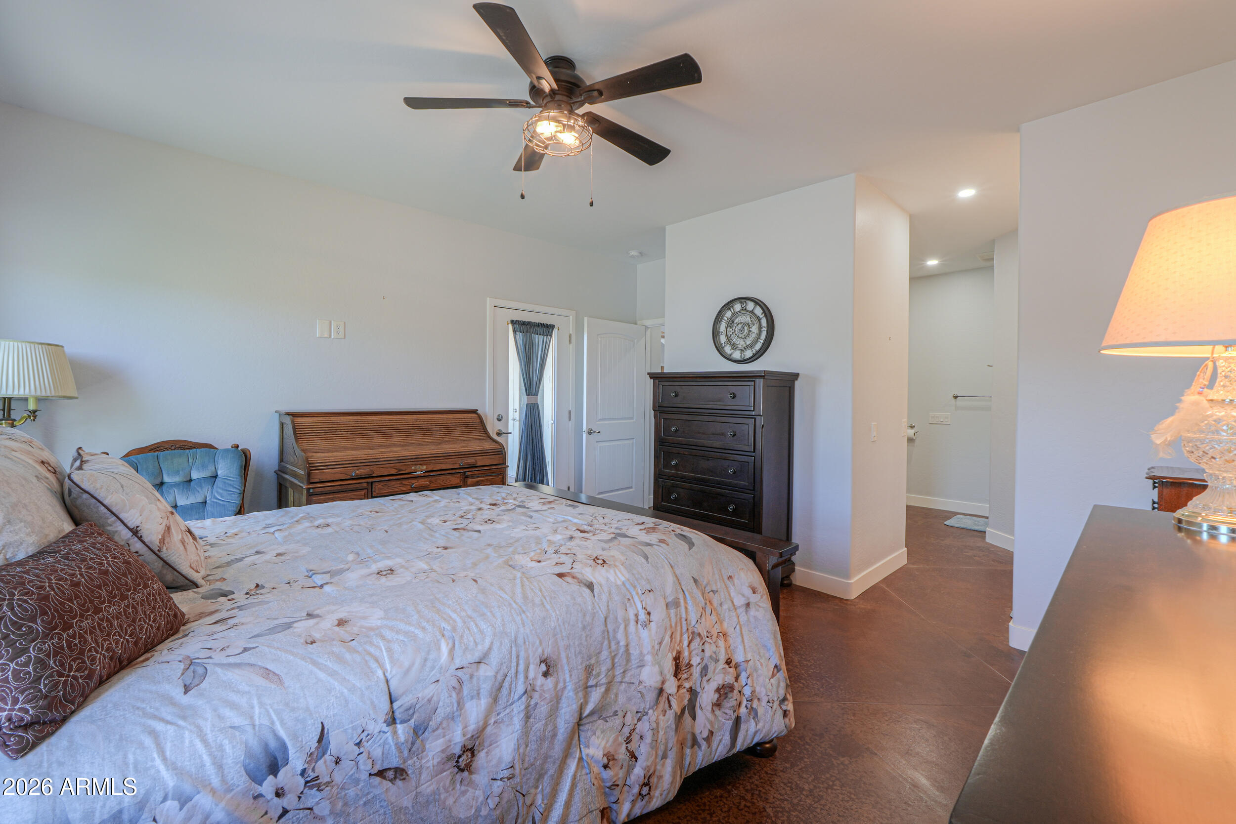 11422 North Hazeldine Road Casa Grande, AZ 85194 - Photo 24 of 59 a bedroom with a bed and a chandelier