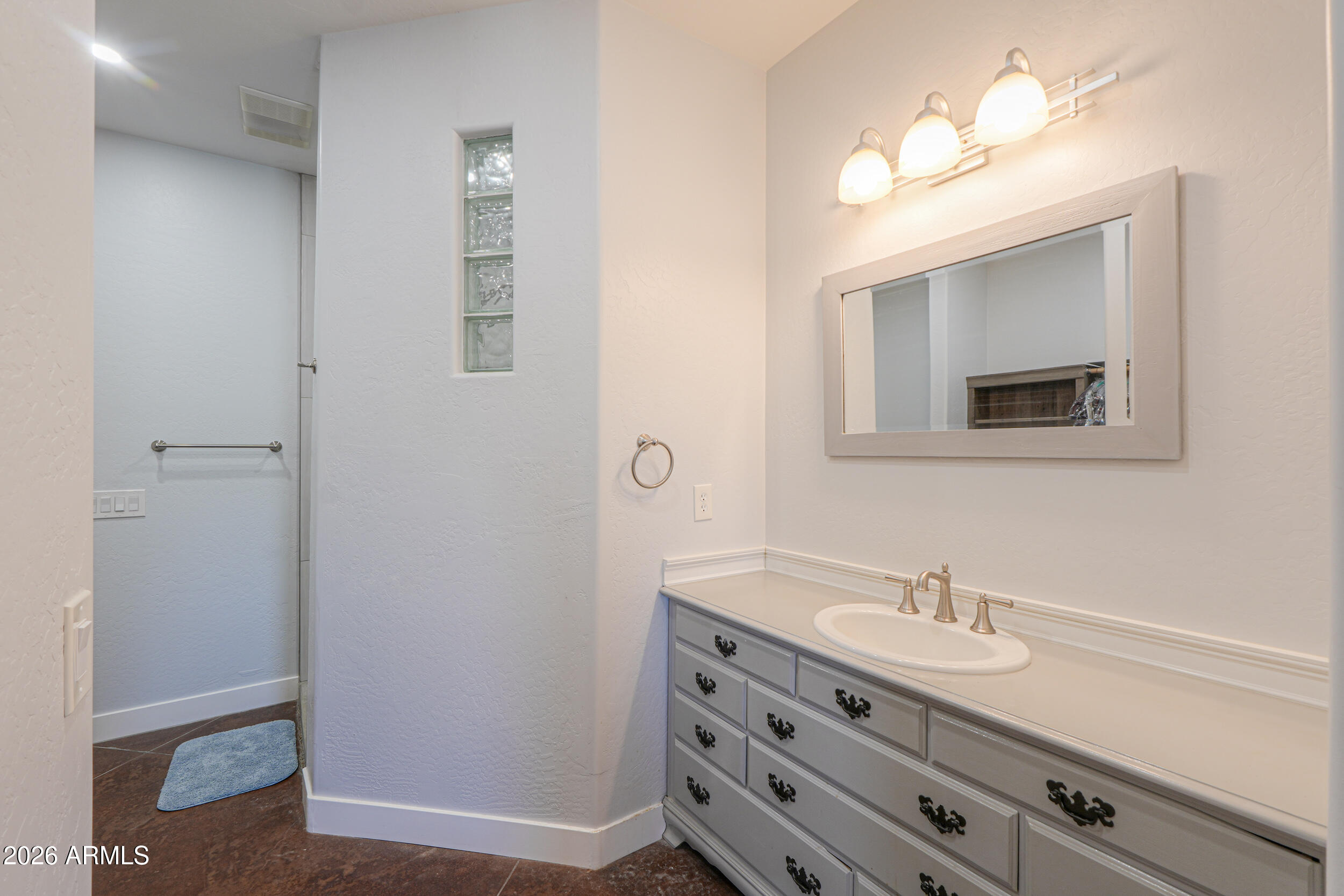 11422 North Hazeldine Road Casa Grande, AZ 85194 - Photo 25 of 59 a bathroom with a sink double vanity and a mirror