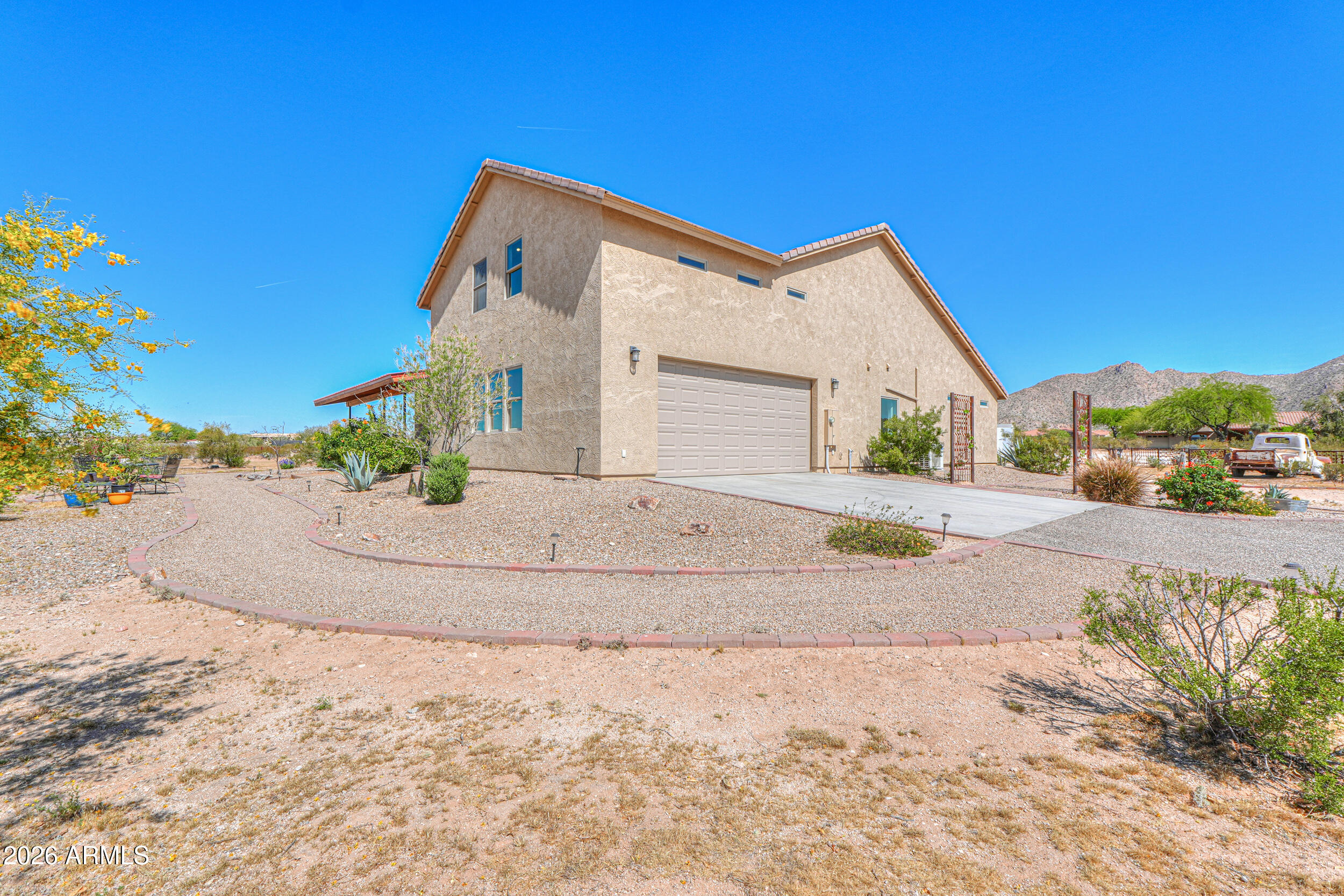 11422 North Hazeldine Road Casa Grande, AZ 85194 - Photo 3 of 59 a front view of a house with a yard