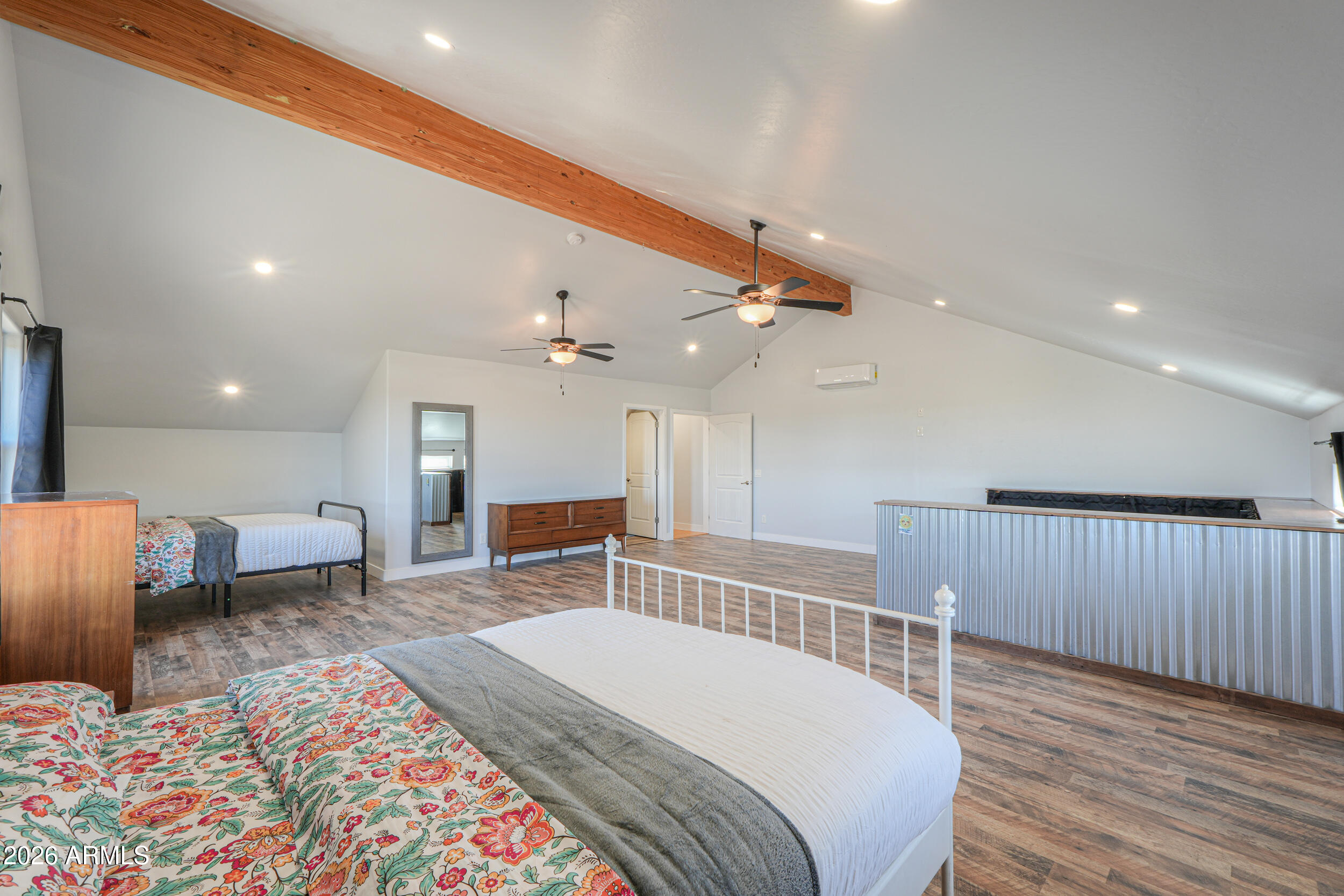 11422 North Hazeldine Road Casa Grande, AZ 85194 - Photo 40 of 59 a spacious bedroom with a bed a couch and dresser