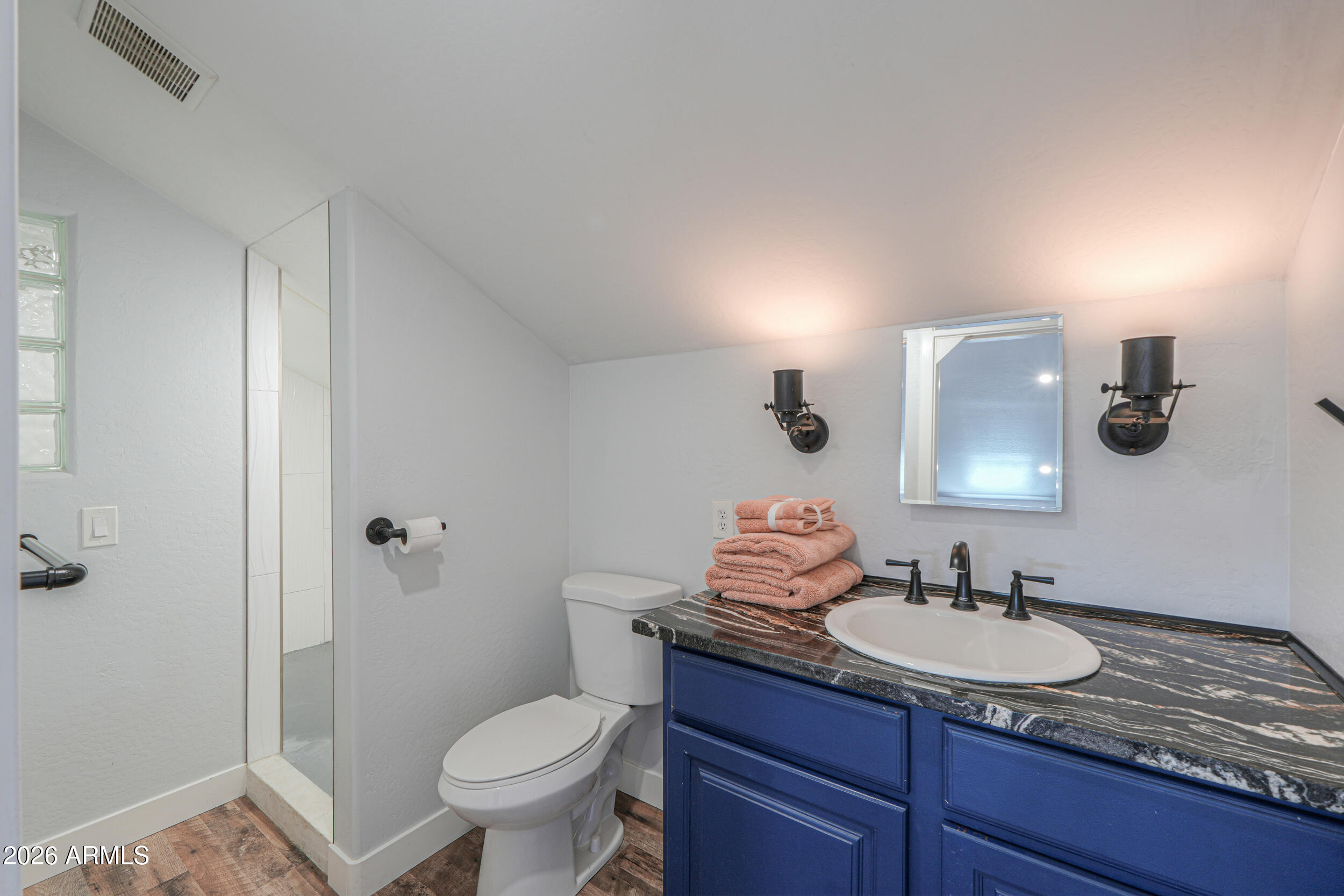 11422 North Hazeldine Road Casa Grande, AZ 85194 - Photo 41 of 59 a bathroom with a granite countertop sink a toilet and a mirror