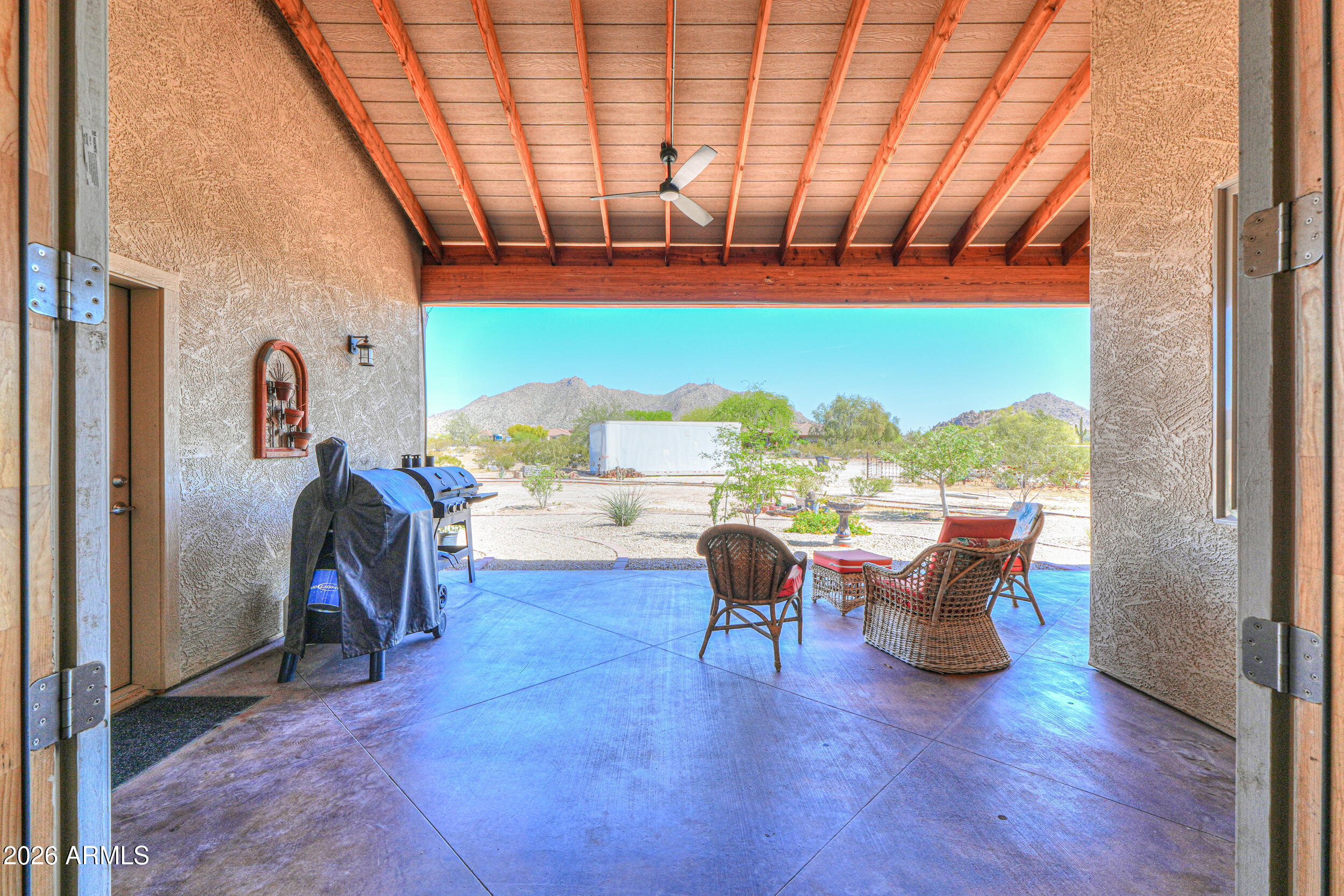 11422 North Hazeldine Road Casa Grande, AZ 85194 - Photo 43 of 59 a living room with furniture a rug and a large window