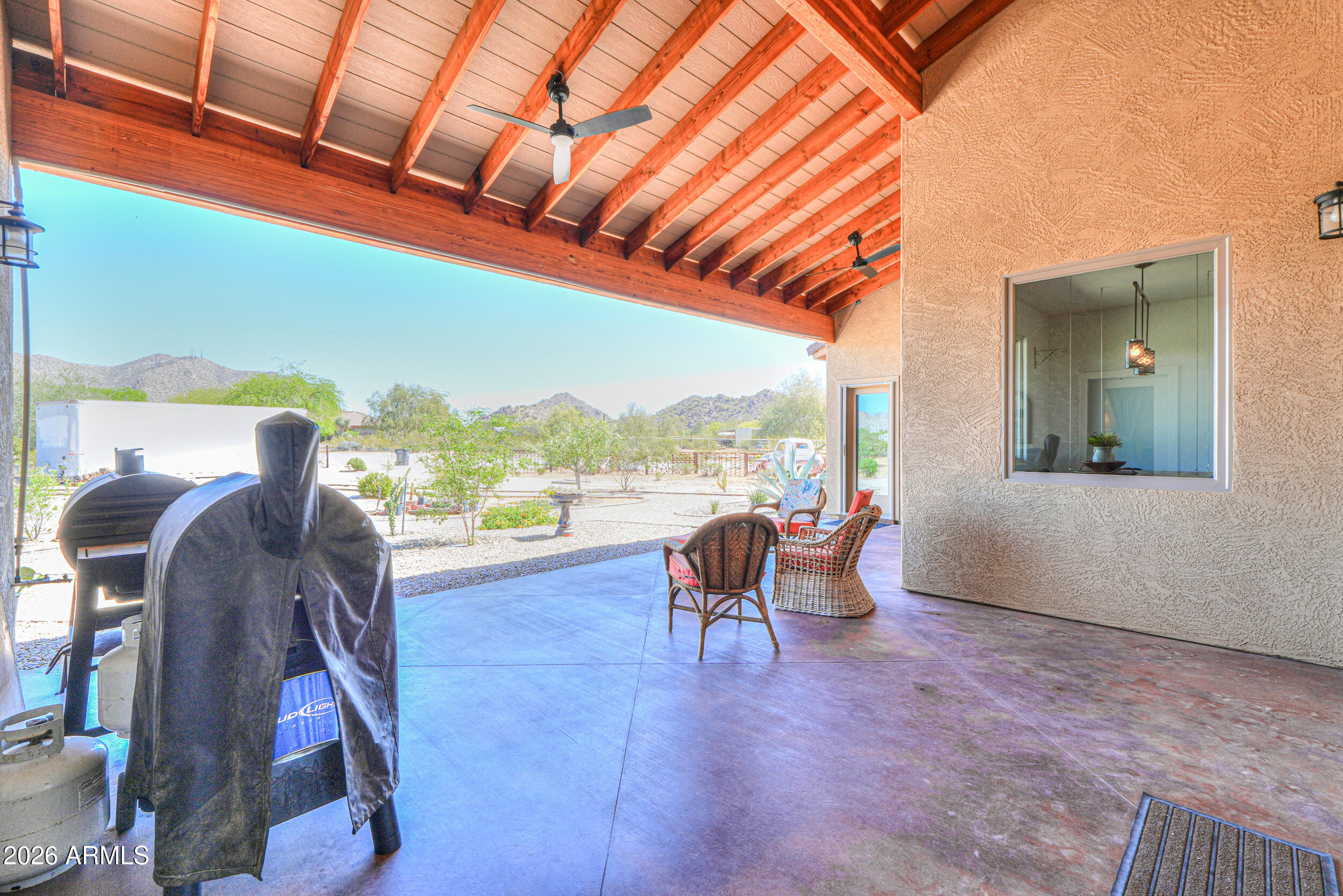 11422 North Hazeldine Road Casa Grande, AZ 85194 - Photo 45 of 59 a living room with furniture and a floor to ceiling window
