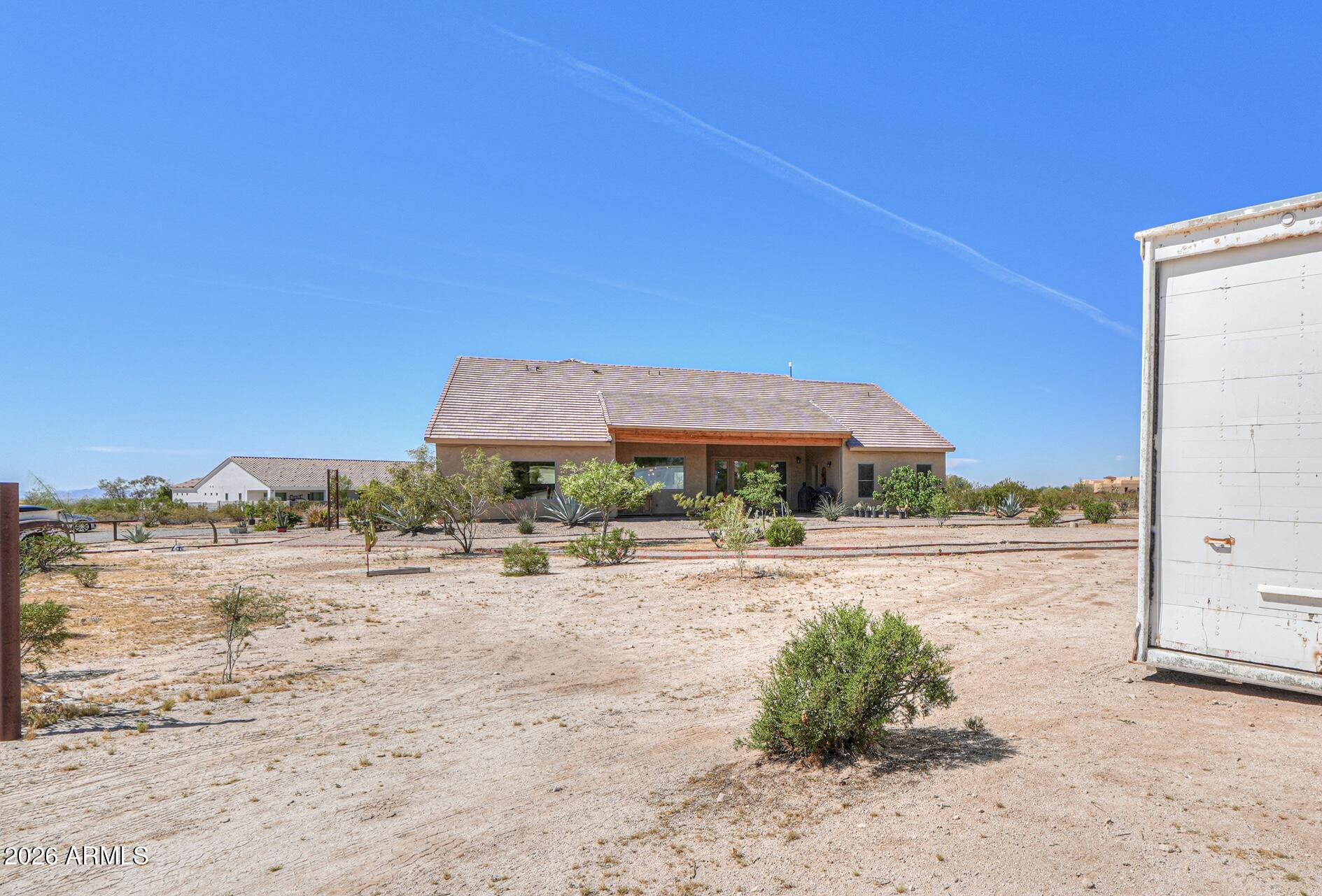 11422 North Hazeldine Road Casa Grande, AZ 85194 - Photo 47 of 59 a view of a dry yard with wooden fence