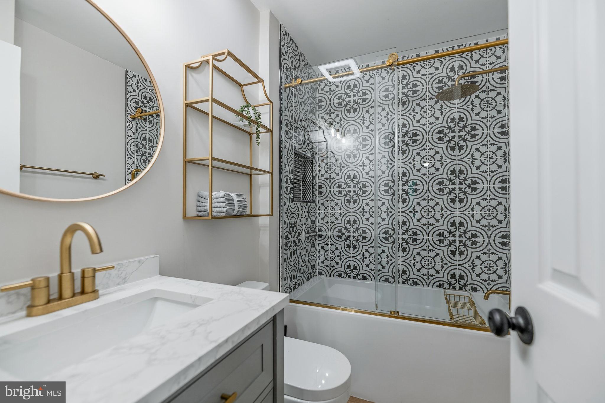 7603 Modisto Lane Springfield, VA 22153 - Photo 32 of 57 a bathroom with a sink toilet and shower