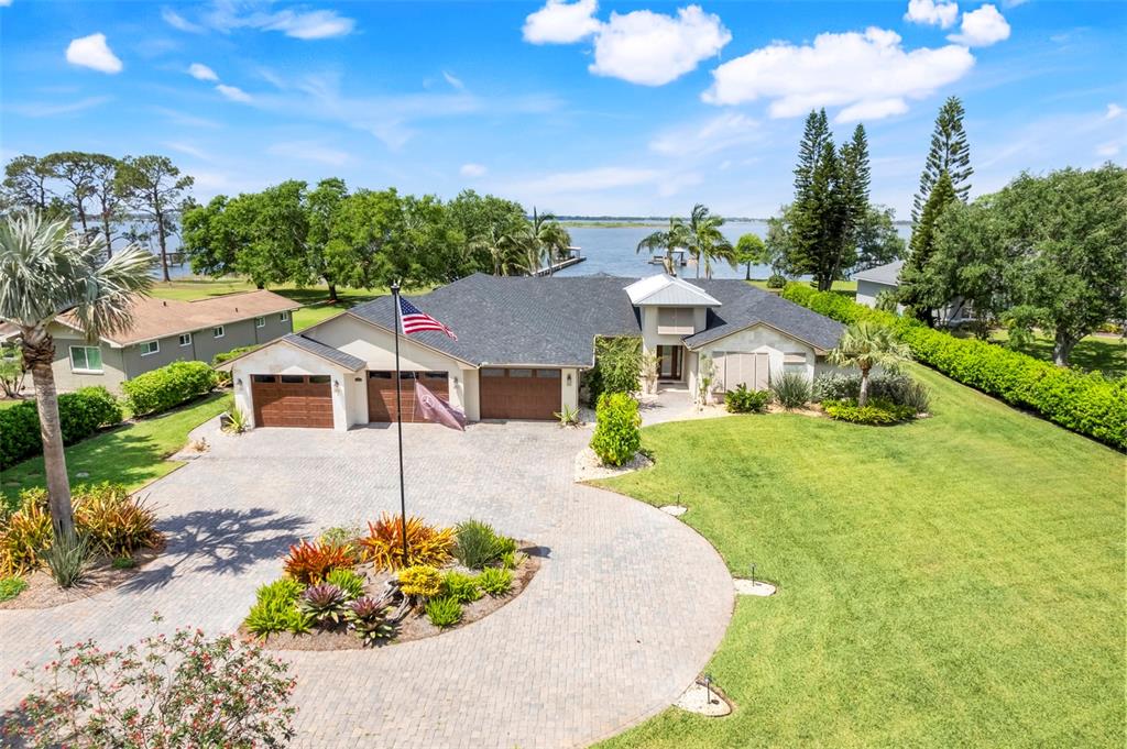 3640 Crump Road Winter Haven, FL 33881 - Photo 1 of 1 a front view of a house with a yard and garage