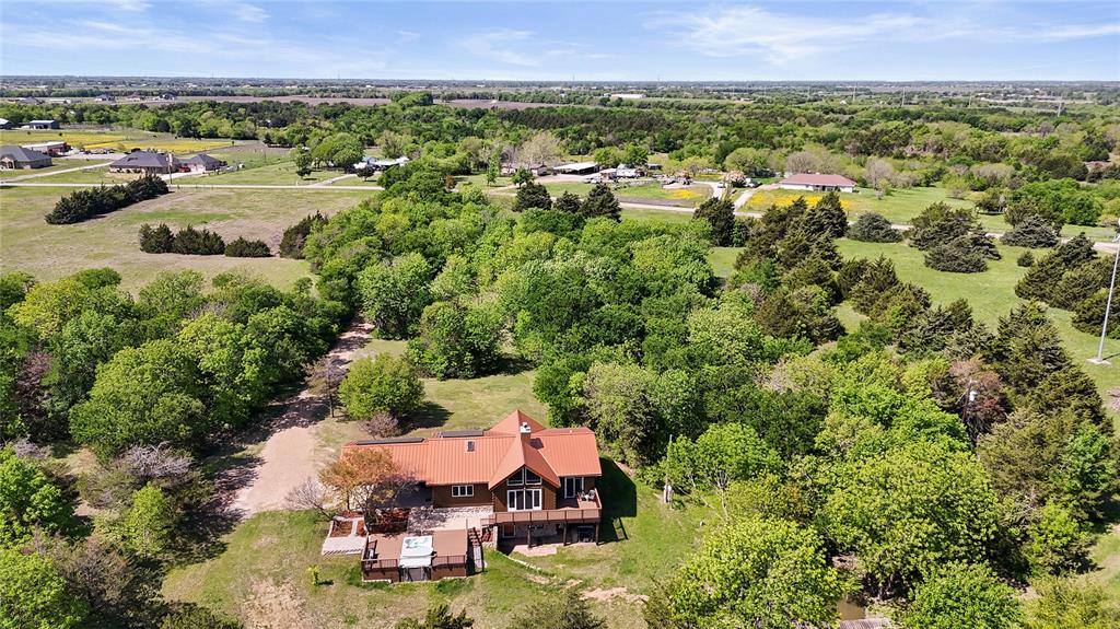 821 Ewing Road Ferris, TX 75125 - Photo 35 of 40 an aerial view of a house with a yard