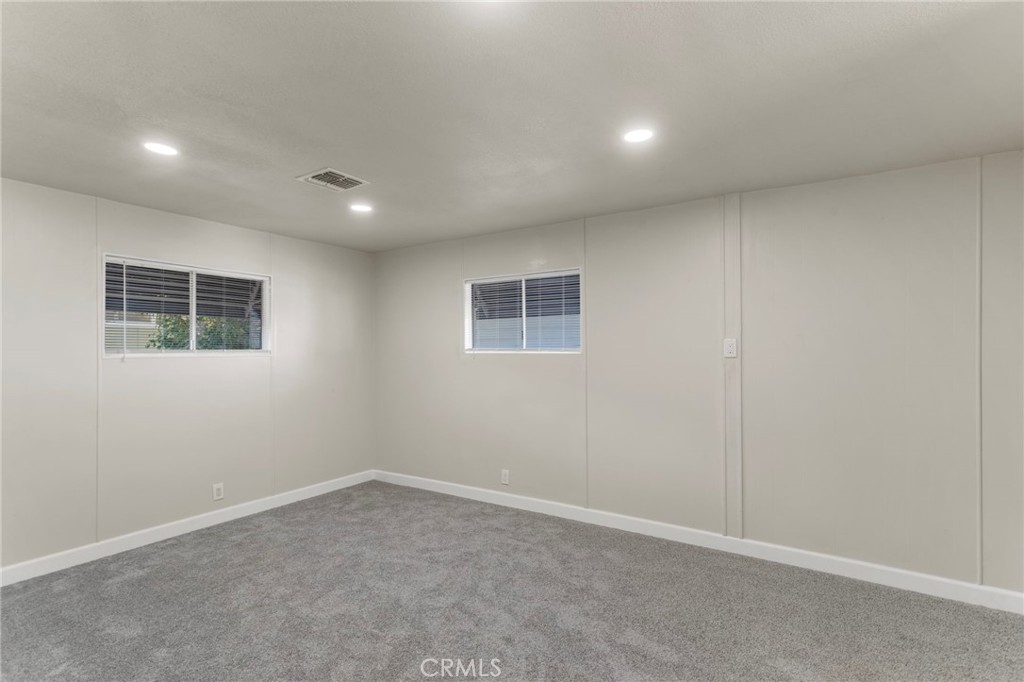 1001 West Lambert Road, Unit 179 La Habra, CA 90631 - Photo 11 of 27 an empty room with windows
