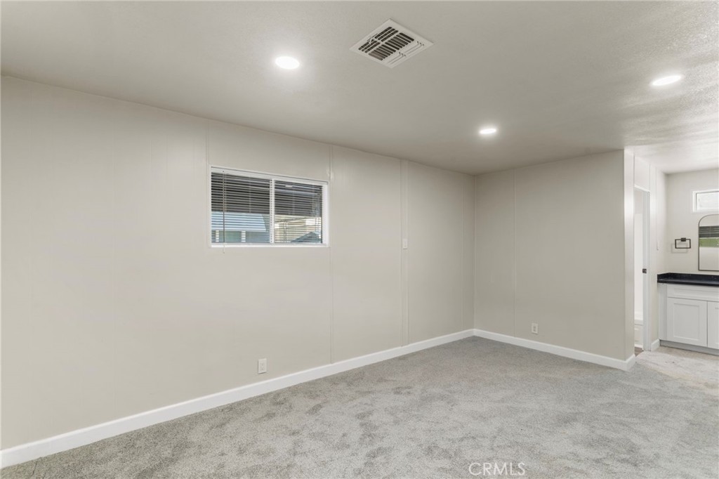 1001 West Lambert Road, Unit 179 La Habra, CA 90631 - Photo 12 of 27 an empty room with a empty space and a window