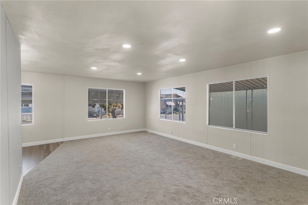 1001 West Lambert Road, Unit 179 La Habra, CA 90631 - Photo 14 of 27 an empty room with windows and closet