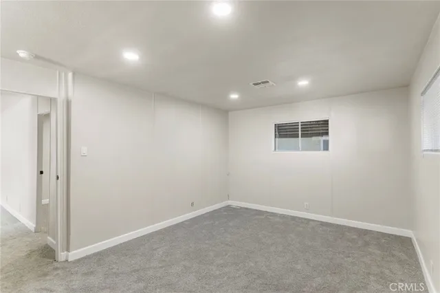 an empty room with a empty space and window