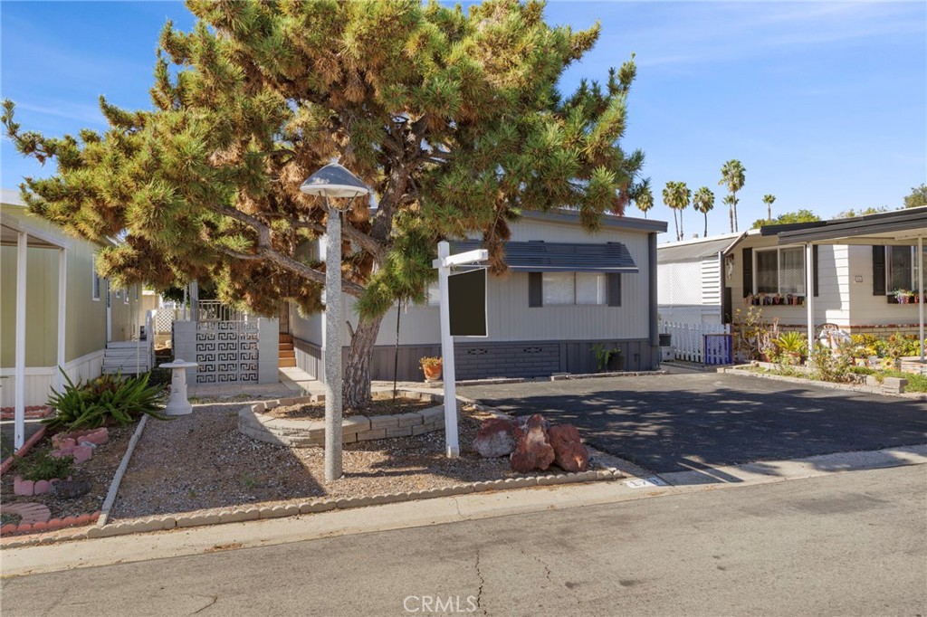 1001 West Lambert Road, Unit 179 La Habra, CA 90631 - Photo 2 of 27 a front view of a house with garden