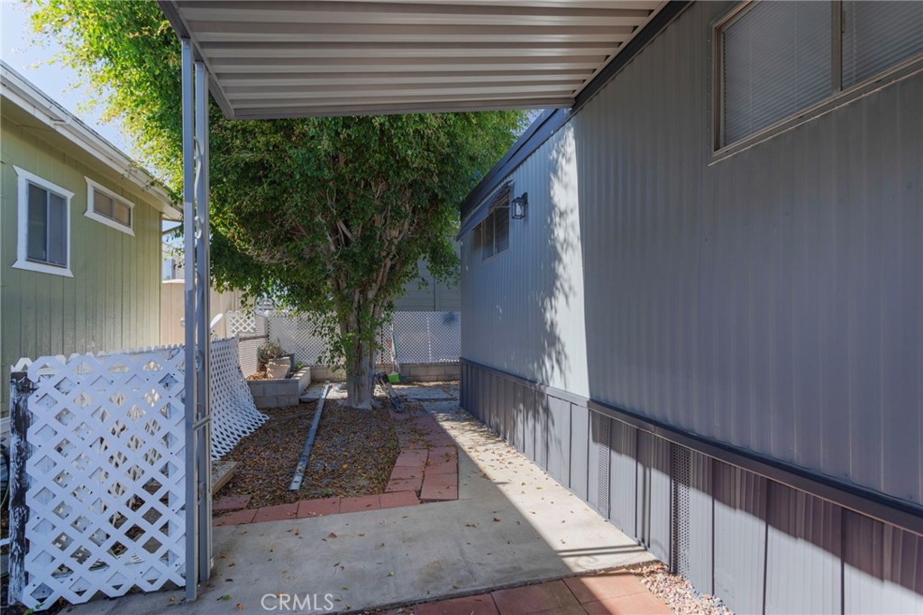1001 West Lambert Road, Unit 179 La Habra, CA 90631 - Photo 23 of 27 a view of a porch with furniture and next to a yard