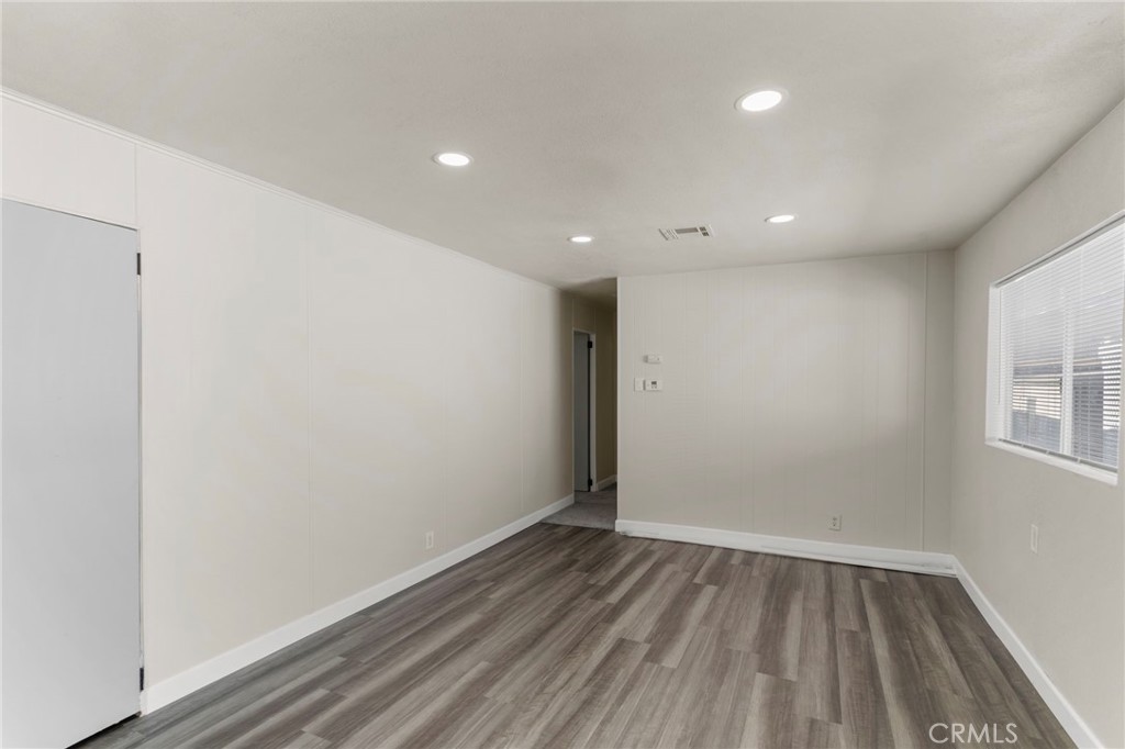 1001 West Lambert Road, Unit 179 La Habra, CA 90631 - Photo 9 of 27 a view of room with window and wooden floor