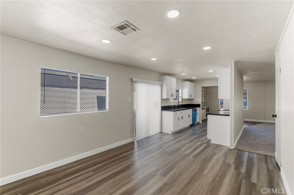 1001 West Lambert Road, Unit 179 La Habra, CA 90631 - Photo 10 of 27 a kitchen with a refrigerator and a sink