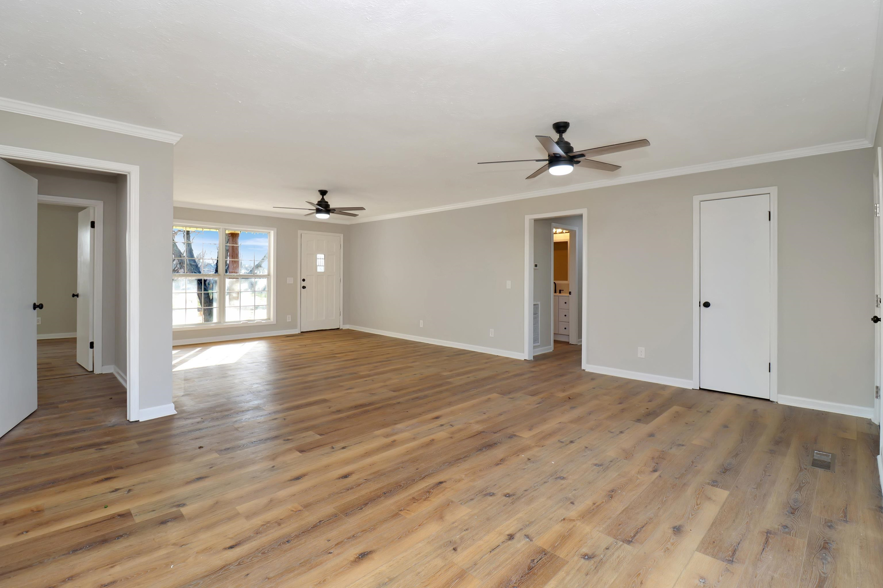 1810 OLd State Rte 76 McKenzie, TN 38201 - Photo 8 of 23 a view of an empty room with window and wooden floor