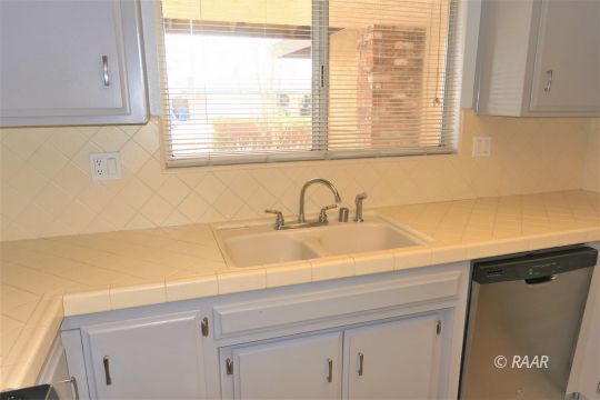 332 Larkspur Street Ridgecrest, CA 93555 - Photo 9 of 28 a bathroom with a sink and a window