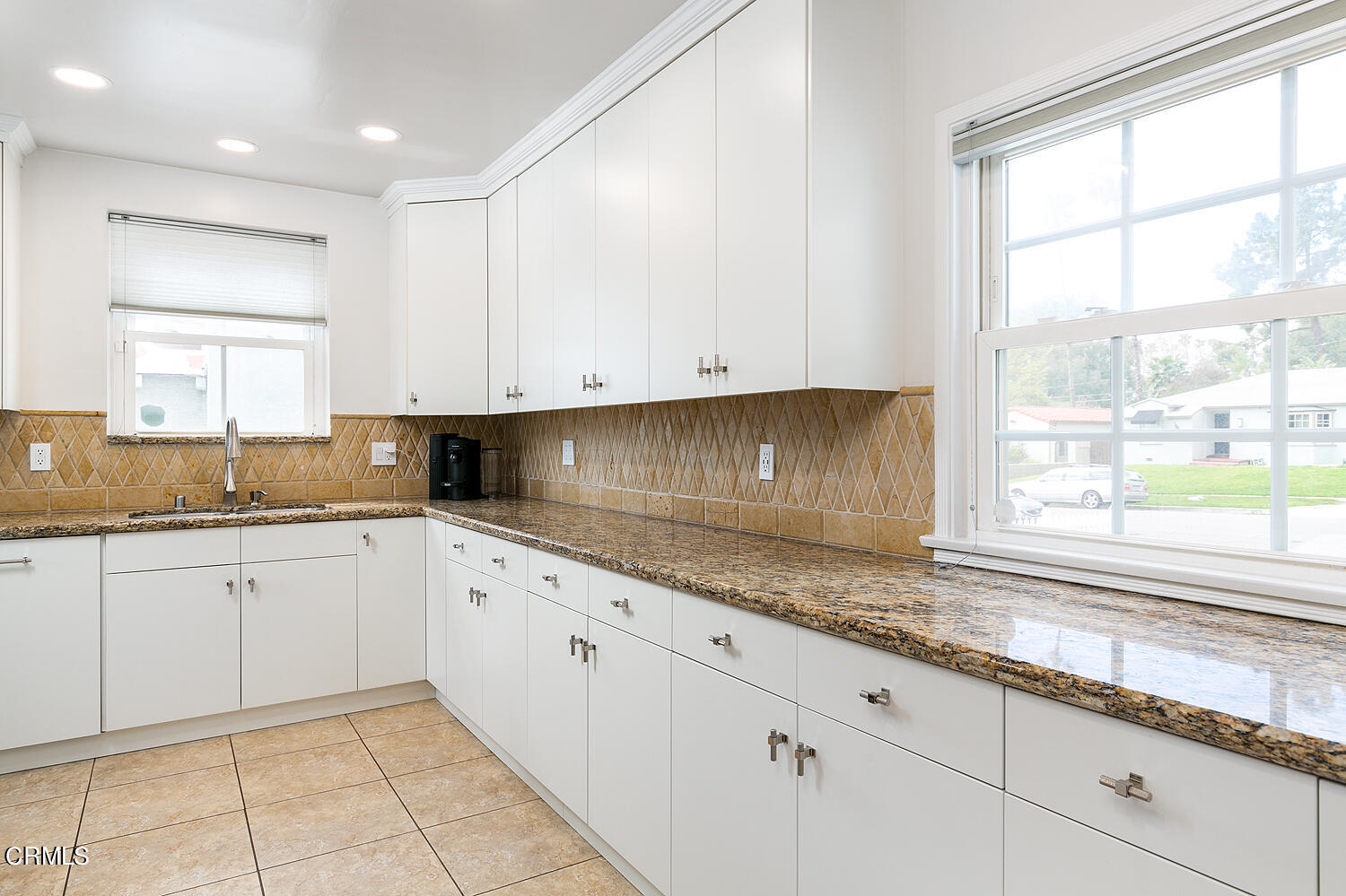 Undisclosed Address Altadena, CA 91001 - Photo 12 of 47 a kitchen with granite countertop white cabinets stainless steel appliances and a window