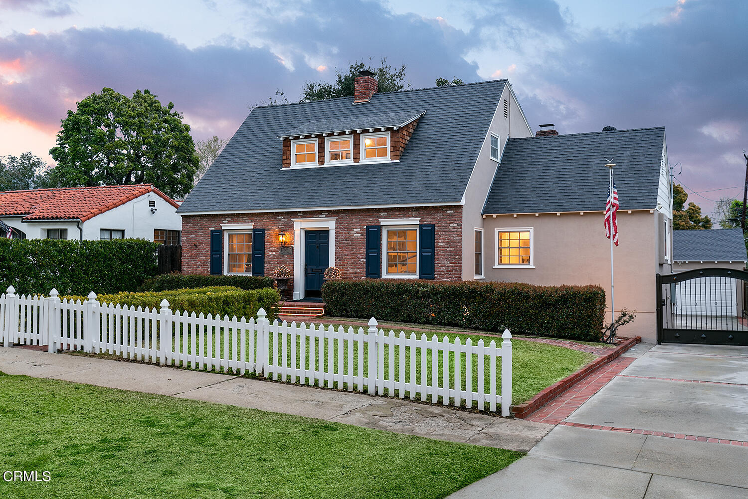 Undisclosed Address Altadena, CA 91001 - Photo 2 of 47 a front view of a house with a garden