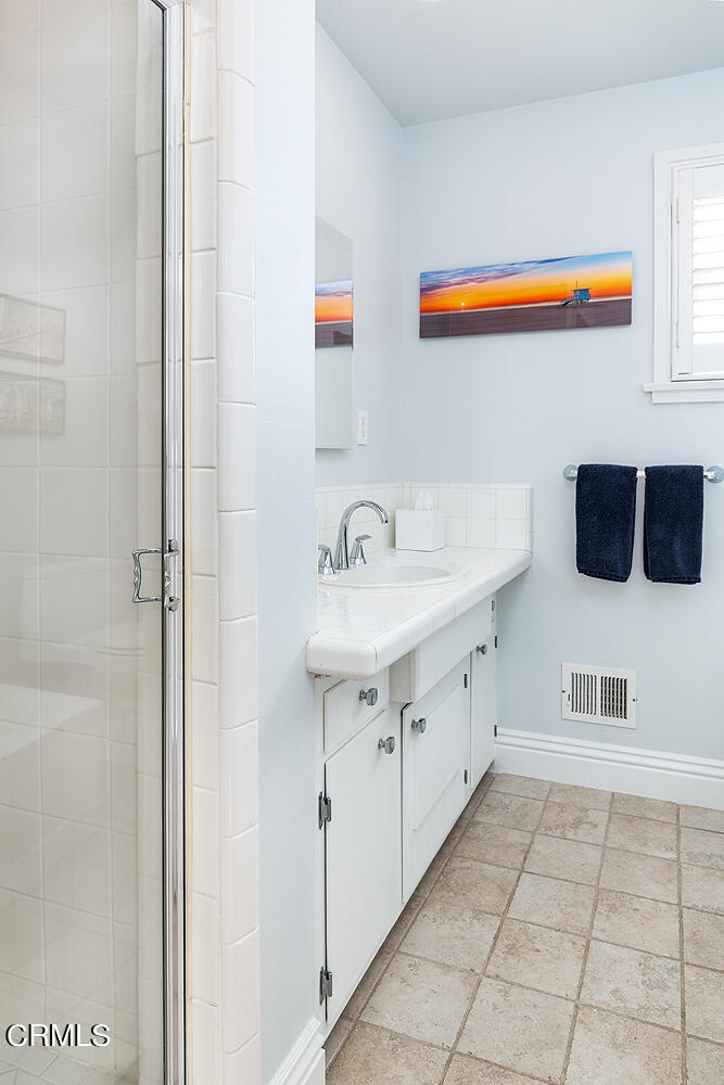 Undisclosed Address Altadena, CA 91001 - Photo 23 of 47 a spacious bathroom with a sink and a mirror