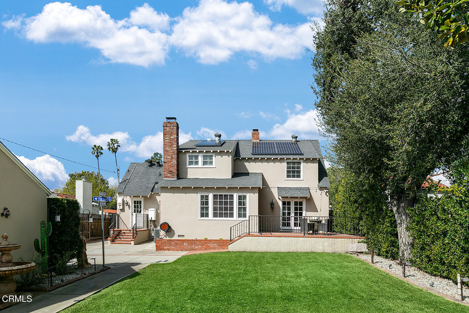 Undisclosed Address Altadena, CA 91001 - Photo 32 of 47 a front view of a house with a garden and plants