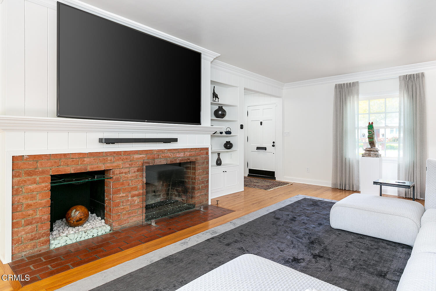 Undisclosed Address Altadena, CA 91001 - Photo 8 of 47 a living room with furniture a flat screen tv and a fireplace