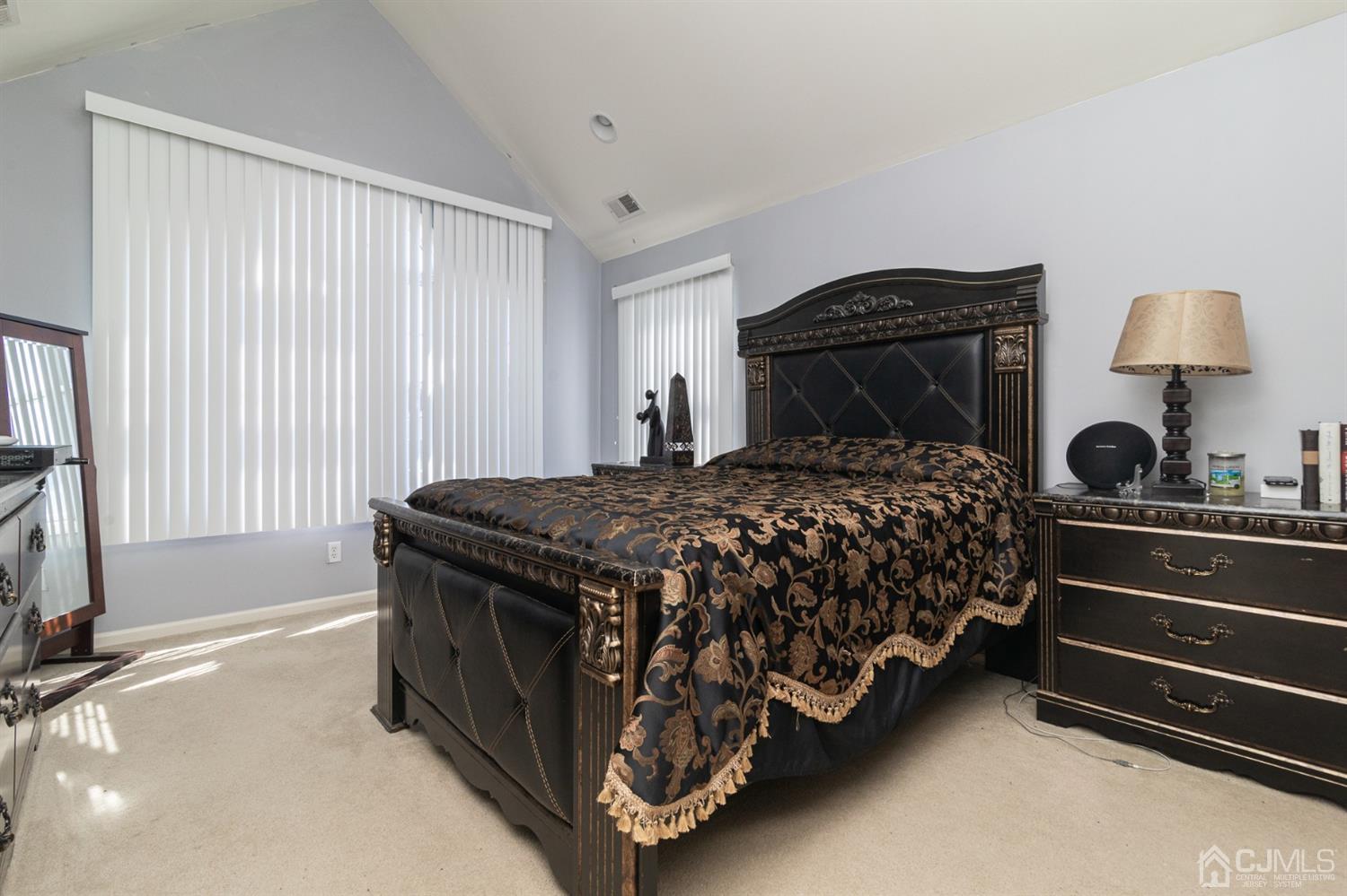 60 Raritan Reach Road, Unit 30 South Amboy, NJ 08879 - Photo 22 of 36 a bed sitting in a bedroom next to a window