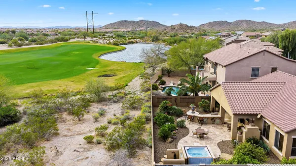 an aerial view of a house with a big yard