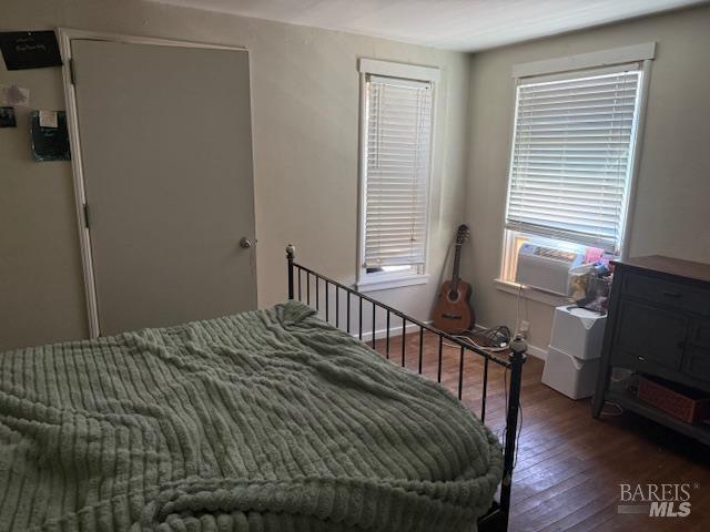 618 Benton Street Santa Rosa, CA 95404 - Photo 22 of 27 a bedroom with a bed next to a large window