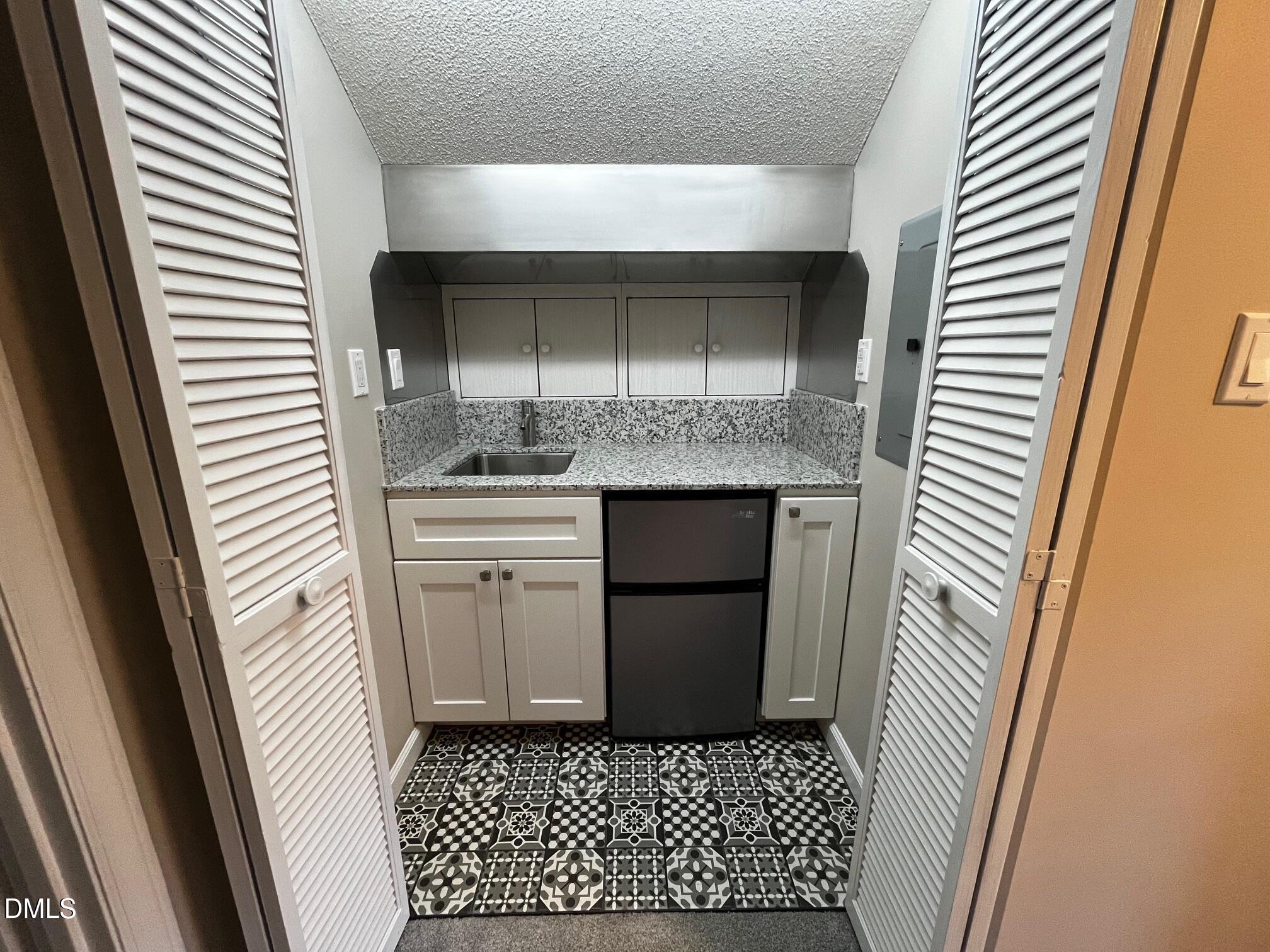 6504 Jade Tree Lane Raleigh, NC 27615 - Photo 22 of 28 Mini kitchen third floor